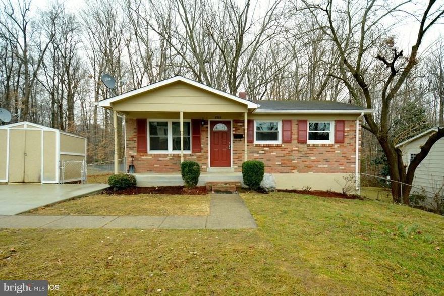 Beautifully Remodeled front porch rambler situated on a large level fenced yard backing to woods.