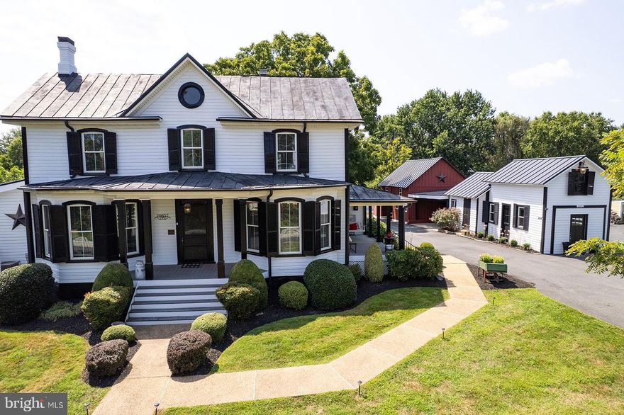 Price improvement makes this your home for the holidays! There is even an option for the curated furnishings to convey! The main level primary suite and guest cottage are added bonuses for multi-generational guests and living.  Step into a rare piece of Loudoun County history at the original Harding family mansion, built in 1871 and beautifully reimagined for today’s lifestyle.  This spectacular home evokes nostalgia and charm, harkening back to a simpler time when days were spent leisurely swinging on the side porch, reading or relaxing on the "sleeping porch" or playing games on the expansive lawn.  Nestled on nearly an acre in the heart of historic Old Loudoun, and steps from the W&OD trail, this one-of-a-kind Victorian blends the craftsmanship of yesteryear with the comfort and amenities of modern living.

Thoughtfully expanded in 2017 with a stunning 1,180 sq ft main-level primary suite addition, the main residence offers 4 generously sized bedrooms, and 3.5 baths. The renovated barn with half bath is the ultimate entertainment venue, known as Jack's Barn or the Cole Cantina, this space is reminiscent of an old honky tonk with antique wooden slat walls, a full bar, and a billiards room on the lower level, it is the ultimate party or hang out spot.  A separate structure with it's own address, is Loudoun County's first doctor’s office, it now serves as a versatile studio with a full bath, perfect for guests, a home office, or creative pursuits.  If one should dare, the original outhouse is still on the premises, as is a workshop and plenty of storage spaces.

Prepare to be impressed by the creativity, warmth and style that is apparent in every room of this gracious home.  The kitchen is a true showpiece—featuring butcher block countertops with generous prep space, along with period-inspired finishes that honor the home’s heritage while providing modern functionality. The magazine worthy primary suite showcases an incredible closet with antique armoire and dressers that have been seamlessly integrated into a dream closet.  Updated bathrooms have timeless style with hand selected vintage fixtures and vanities married with contemporary finishes and quality craftsmanship to create unique spaces.  To preserve the character that makes this property truly special, many original treasured details have been saved, including restored hardwood floors, millwork, and the main staircase.

The grounds are designed for living and entertaining. A heated pool with an expansive deck, multiple patios, a fire pit, and wide-open lawns create a private retreat for gatherings large or small.   This is more than a home—it’s a lifestyle. Whether you envision summer pool parties, cozy fireside evenings, a barn dance or simply savoring the peace of your own historic sanctuary just minutes from shops, dining, and commuter routes, this home offers endless possibilities. Extras: No HOA, Horses Allowed!  Experience the perfect blend of history, comfort, and lasting memories in one extraordinary property make 20857 Ashburn Road yours.