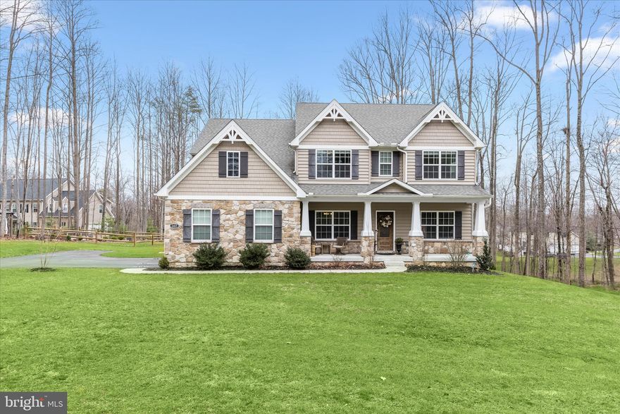 Welcome to 307 Red Meadows Court, a stunning Colonial residence gracefully set on a peaceful 2.09-acre homesite in the sought-after community of Temples Delight. Surrounded by serene wooded views, this exceptional property offers the perfect blend of refined living and tranquil outdoor spaces, highlighted by an expansive deck, custom patio, built-in pergola, fenced garden area, attached two-car garage, and a welcoming covered front porch.
Step inside to discover beautifully appointed interiors where luxury vinyl plank flooring, oversized windows, classic moldings, and a soft neutral palette create a timeless and elegant atmosphere throughout the main living areas. The inviting foyer is flanked by formal living and dining rooms, ideal for entertaining and everyday gatherings.
At the heart of the home, the chefs eat-in kitchen is thoughtfully designed with quartz countertops, decorative backsplash, stainless steel appliances, a center island with breakfast bar and pendant lighting, a pantry, and a bright breakfast room with direct access to the deck, making indoor-outdoor living effortless. Just off the kitchen, the family room offers a warm and comfortable retreat anchored by a cozy fireplace. A functional mudroom with garage access and a powder room completes the main level.
Upstairs, the primary suite serves as a private sanctuary, featuring a tray ceiling, two walk-in closets, and a spa-inspired en-suite bath with separate vanities, a slipper soaking tub, and a walk-in shower. Three additional spacious bedrooms each with walk-in closets along with a full hall bath and a convenient laundry room complete the upper level.
The finished lower level extends the living space with a recreation room that opens directly to the custom patio, offering peaceful wooded views and an ideal setting for relaxation or entertaining. A full bath and abundant storage complete this impressive level.
Blending elegant interiors, thoughtful design, and beautiful outdoor living, 307 Red Meadows Court presents a remarkable opportunity to enjoy refined living in a picturesque setting.