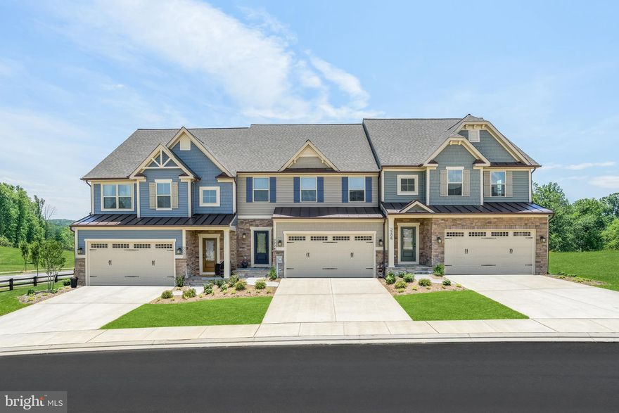 IMMEDIATE MOVE IN! Welcome home to the Griffin Hall located in the Woodlands, Urbana's only EXCLUSIVE 55+ active adult community! This stylish villa comes fully loaded  with a 2 Car Garage, Finished Basement, Sonoma Painted Linen Cabinets, Quartz Countertops, Covered Porch, Finished Storage Room, Hardwood Stairs w/ Metal Ballisters,