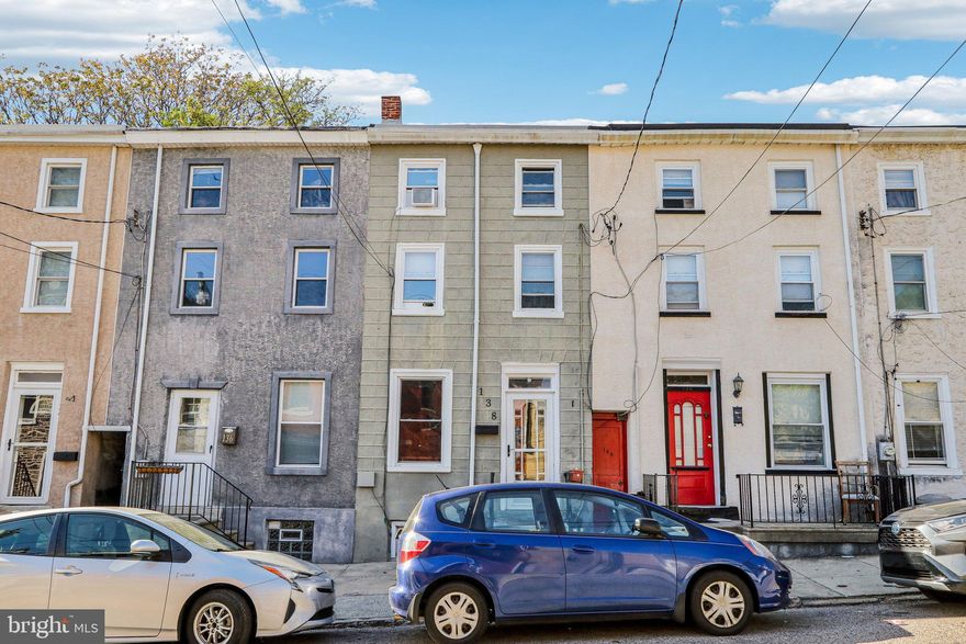 Welcome to this beautifully maintained traditional Philly rowhome, ideally situated in the heart of Manayunk just blocks from vibrant Main Street! This inviting 3-bedroom, 1-bath home blends classic charm with modern touches and features an open concept floor plan perfect for both everyday living and entertaining. Enter inside to discover durable vinyl plank flooring that flows seamlessly through the combined living and dining rooms, offering a spacious layout filled with natural light. The eat-in kitchen boasts generous cabinet and counter space, including a convenient built-in buffet—ideal for hosting. Just off the breakfast nook, sliders lead outside to your private, remodeled backyard retreat featuring a ground-level deck and thoughtfully designed garden beds—perfect for relaxing or entertaining outdoors. Upstairs on the second floor, you'll find a large hall bathroom with built-in storage, a dedicated laundry room, and a comfortable bedroom. The third floor offers two oversized bedrooms, each with ample closet space and room to spread out. A full basement provides incredible potential—use it for storage as-is or finish it off to create additional living space. Built-in closets and a workbench have been removed to create even more space. Notable upgrades include the replacement of outdated clay piping with modern PVC. This home’s unbeatable location puts you just blocks away from the best of Manayunk, including renowned restaurants, bars, local shops, Pretzel Park, Venice Island Playground, and the scenic Schuylkill River Trail. Whether you're a first-time buyer or looking for your forever home, this Manayunk gem is not to be missed!