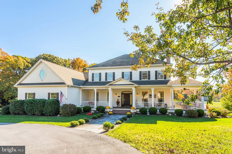 Introducing an exquisite Southern-style colonial residence, complete with a charming wrap-around porch, nestled in the heart of Howard County. Spanning over 6,000 square feet, this magnificent home offers an abundance of space, intricate details, and the modern conveniences you desire in a luxury property—all while exuding a warm and inviting atmosphere throughout its multi-level layout. From the elegant circular driveway to the enchanting front porch and expansive back deck, every aspect of the beautifully landscaped grounds has been thoughtfully curated with care and precision.

The gourmet kitchen, featuring a delightful breakfast nook that overlooks the backyard, is perfect for culinary enthusiasts. The main level boasts a spacious primary bedroom and bathroom, a breathtaking great room, and a grand two-story foyer that welcomes you in style. The formal living and dining rooms are equally impressive, providing elegant spaces for entertaining.

The finished basement is a true gem, offering an in-law suite complete with a full kitchen, bedroom, and bathroom. This space also features a cozy stone gas fireplace, a bar, and a media room ideal for watching games, movies, or hosting unforgettable gatherings. Upstairs, you’ll discover four generously sized bedrooms, each offering stunning views, along with two spacious full bathrooms and an expansive bonus room that can easily serve as a home office, playroom, or comfortable living space for an au pair.

In addition, this stunning custom home is situated within the prestigious equestrian community of Paternal Gift Farm, renowned for its breathtaking beauty and craftsmanship. This award-winning neighborhood showcases twenty-nine luxurious homes, surrounded by forty-nine acres of meticulously maintained pastures. Residents enjoy diverse equine boarding options, a serene private fishing pond, picnic areas, and a scenic 1.7-mile walking path.

Located within the River Hill High School district, this community is conveniently adjacent to Schooley Mill Park, which features a professionally maintained equestrian ring, an eventing course, miles of picturesque riding trails, an exciting playground, and recently renovated sports courts and fields. The unique ambiance and strong sense of community here create an unparalleled living experience. The shared equestrian amenities are expertly managed, ensuring they remain profitable and well-maintained for all residents. The architectural diversity throughout the neighborhood is striking, with each custom luxury home boasting captivating designs and impeccable upkeep.