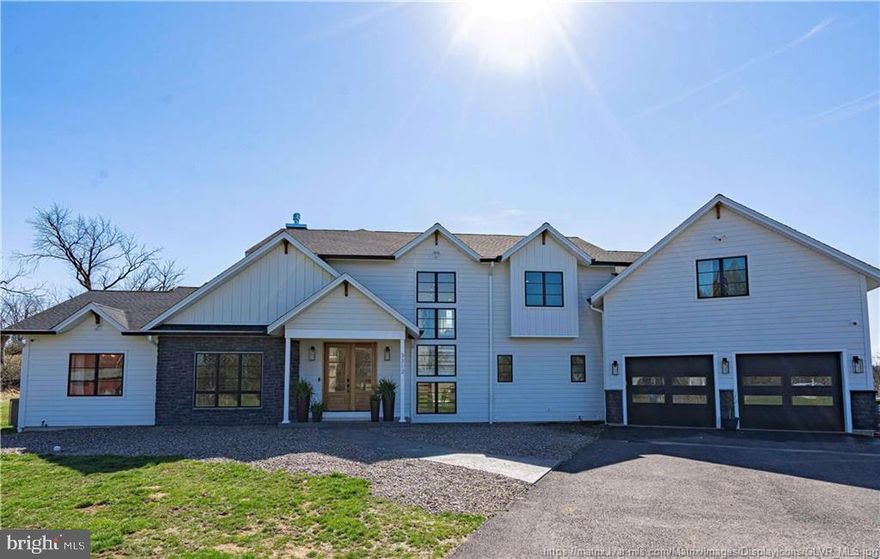 This is the type of home people dream about, and now the opportunity to make it yours is here! This stunning home offers 5 bedrooms and 4.5 baths on a sprawling 3.5+ acre property, conveniently located at the edge of North Whitehall Twp in the desirable Parkland SD. This home has unparalleled design and curated style at every turn. The layout was so carefully done to bring in light and maximize the gorgeous, panoramic views. It is invigorating to step into the open-concept living area. Once you see the wall of windows and the glass doors that span the back, you know exactly how special and unique this home really is. The kitchen is breathtaking, where style meets function with a large island, high-end Jenn Air appliances, quartz counters, and convenient deep drawers. The pantry is laid out strategically, offering maximum storage and utility behind doors while balancing beautiful display spaces. The 1st floor primary suite is surreal, with fantastic windows and fireplace, and a dreamy walk-in closet and en suite. Four additional bedrooms, all with oversized closets and 2 full baths on the second floor. The basement is a go-to destination with a theater room, a wet bar, even a built-in pet house under the stairs! A spacious gym, cigar room with proper ventilation, AND a game room! Plus, lots of storage behind doors. RV garage. 4 zone HVAC. Don't miss this RARE opportunity to live your life in this spectacular, beautifully designed home, with remarkable comfort and function!