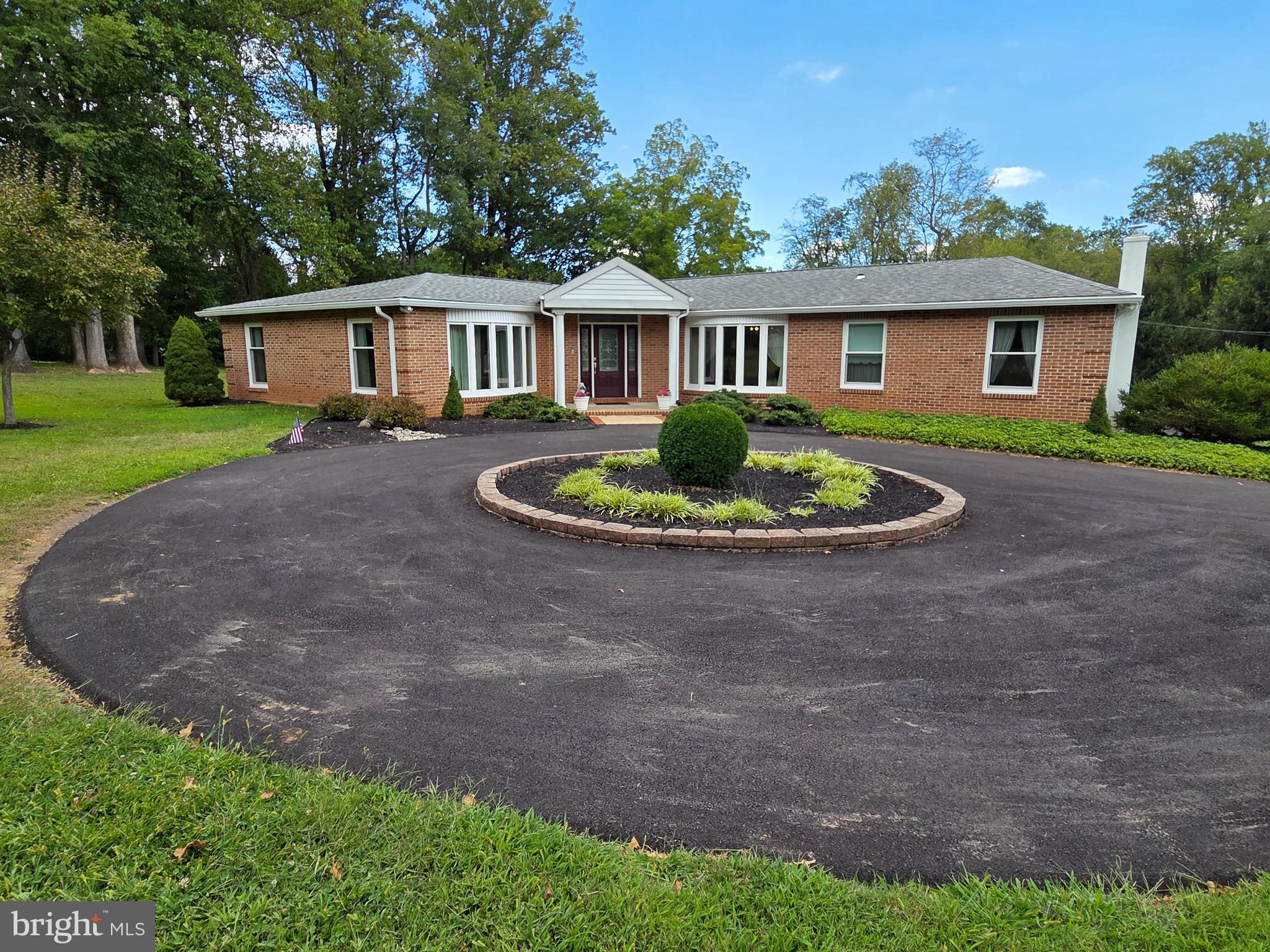 Looking for your piece of paradise? Here it is! Beautifully maintained brick front rancher on OVER 3 ACRES in desirable Huntingdon Valley offers a peaceful, private setting with convenient access to nearby amenities. Features include hardwood floors, neutral decor, beautiful new vinyl bow windows in living room and dining room, newly updated master bathroom with new double bowl vanity top & new solid surface easy care Bath Fitter shower, a gorgeous new high quality front door with leaded glass side lights and transom, a propane operated whole house generator, upgraded electric, and more! This home has a spacious layout with plenty of natural light and has been immaculately kept and upgraded! The master bedroom has sliding glass doors to a covered deck, perfect to enjoy the outdoors with your morning coffee! Two more bedrooms and another full bath, main floor laundry, eat in kitchen, large living room, dining room, and a well-designed hallway complete the main floor and make this home both warm and functional. On the lower level you will find a large walk out family room and an attached 1 car garage with access to the inside for your convenience. There is also an oversized 1 car detached garage, a beautiful private driveway with a circular driveway at the front door and plenty of parking. This driveway has just been completely resurfaced! Nothing left to do here but move your furniture in! Call today! Don't let this rare find get away!