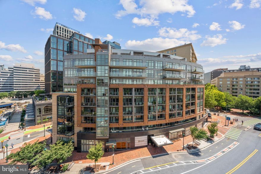 Welcome to 7171 Woodmont Ave #505 — a beautifully designed 2-bedroom, 2-bath condo in The Darcy, one of downtown Bethesda’s premier luxury buildings. This spacious, light-filled residence features soaring ceilings, high-end finishes, and a smart, functional layout that maximizes comfort and style.

Thoughtfully upgraded, the home includes a brand-new washer and dryer (March 2024), stylish new lighting, custom shower doors in the second bathroom, and a premium Dornbracht kitchen faucet with separate hot and cold taps — a significant improvement over the original builder-installed fixtures.

One electric vehicle parking space is included in the price. Buyer has first right of refusal for a second space for $25,000 - largely discounted from market rate. 

The Darcy provides an elevated lifestyle with 24-hour concierge service, a fitness center, club room, guest suites, and more — all located just steps from Metro, trails, shops, restaurants, and everything Bethesda Row has to offer.

Seller is open to selling some furniture upon request - making this a truly turnkey option.