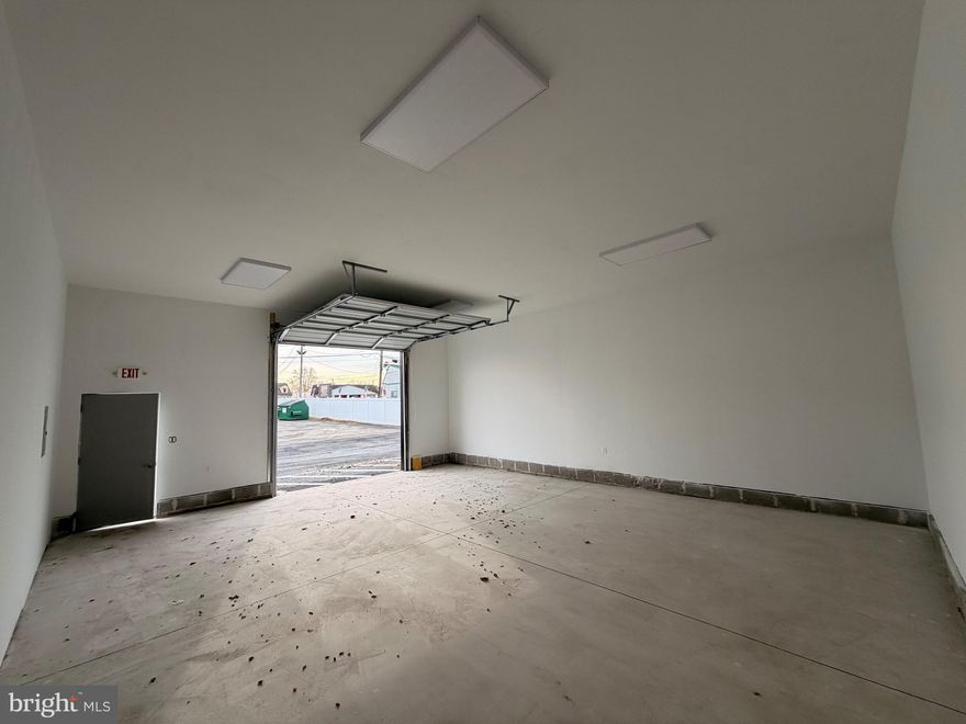 Brand-New 2025 Storage Facility – 6 Premium Units Available on Route 13. Introducing a newly built storage complex offering six spacious 700 sq. ft units, each featuring an impressive 14-foot ceiling height. Every unit is designed with convenience and flexibility in mind—equipped with a high roll-up door, an additional standard entry door, and a clean vanilla-box interior finished with fresh white paint and four bright LED ceiling lights. This fully secured property includes: Keypad-controlled gated access, 20+ security cameras covering all angles, Floodlights throughout the property along with four tall pole lights for maximum visibility at night, Individual electric meters for every unit, Fully fenced grounds for added protection, Perfectly positioned right on Route 13 with quick access to Route 95, this location offers excellent visibility and accessibility for businesses, contractors, or anyone in need of high-quality storage space. A rare opportunity to lease brand-new storage units in a prime, high-traffic location.