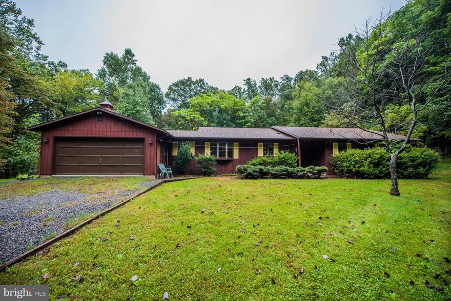 Prime location, nestled in the trees just min. from Cacapon State Park & soon to be revitalized Coolfont Resort. Featuring breakfast nook open to spacious kitchen, sep. laundry room, LR/DR combo w/ pellet stove, Solarium for plant enthusiasts. Family room w wood stove on stone hearth in bsmt. +1/2 BA + workshop/storage rooms. Wraparound deck, 2 car garage & fronts county maintained rd. on 2 lots.