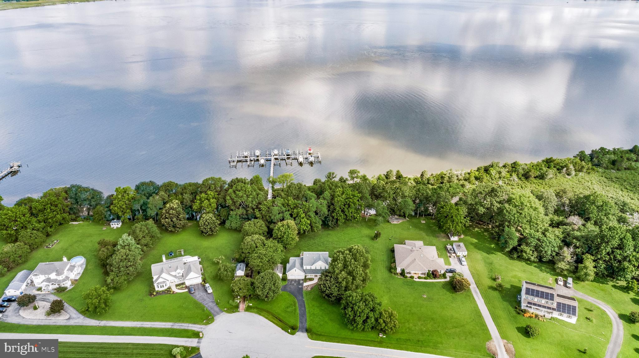 Riverfront Living in Prince Frederick | Deeded Slip + Private Acreage
Perched on a serene 1-acre lot along the Patuxent River, this 4-bed, 3.5-bath beauty offers water views, space to breathe, and a lifestyle worth bragging about. With your own deeded boat slip (#11) just steps away—complete with electric maintained by the HOA—you’re always just moments from the water.
Inside, the home flows effortlessly with thoughtful design and comfort. The upper level features 3 spacious bedrooms and 2 full baths, including a primary suite with panoramic river views, his-and-her walk-in closets, and a spa-like bath with a jetted soaking tub, stand-up shower, and natural light pouring in through large windows.
On the main level, you’ll find a private home office, a welcoming living and dining area, and a bright kitchen outfitted with newer stainless steel appliances, a gas stove, and a sleek pocket door opening to the cozy family room with a gas fireplace. A convenient half bath completes this level.
The lower level offers a separate bedroom and full bath, luxury vinyl plank flooring, and tons of versatility—perfect for guests, multigenerational living, or a bonus space.
Add in energy-efficient geothermal heat pumps (2014) that feed into the water heaters, a newer upstairs furnace, and a decent-sized garage, and you've got a smart, stylish, and sustainable place to call home.
Private, peaceful, and packed with features—this is the riverside lifestyle you've been waiting for. Schedule your showing today!
