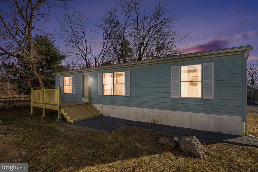 Stunning Fully Renovated Modern 3-Bedroom, 2-Bathroom Double Wide – Move-In Ready Luxury!

Discover the perfect blend of contemporary style and comfortable living in this homey and impeccably renovated double wide manufactured home. Thoughtfully updated from top to bottom, this 3-bedroom, 2-bathroom gem boasts high-end finishes and luxurious details that elevate everyday living.

Step inside to luxurious vinyl plank flooring flowing seamlessly throughout, creating a warm and modern foundation. The heart of the home is the brand-new gourmet kitchen, featuring sleek soft-close cabinets, eye-catching chevron-patterned butcher block countertops, gleaming stainless steel appliances, and a spacious undermount sink. Subtle gold accents add a touch of elegance and sophistication.

The inviting living room is wrapped in classic wainscoting and capped off with a nice chair rail, paired with fresh new trim, updated electrical outlets and switches for a polished look. Modern window treatments enhance privacy and style in every room.

Retreat to three cozy bedrooms, each with  ample storage. Both bathrooms have been completely transformed with contemporary vanities topped in durable solid surface countertops, new toilets, and beautifully resurfaced tub/showers.

Convenience meets functionality in the dedicated laundry room, complete with a washer and dryer, plus new built-in cabinets for organization.

Outside, enjoy relaxing or entertaining on the brand-new deck and beautifully laid patio pavers – perfect for outdoor gatherings.

This home feels like new construction with all the upgrades already done – just unpack and enjoy! Don't miss this rare opportunity for affordable luxury.

LOT RENT IS $425 A MONTH AND INCLUDES WATER, SEWER, & TRASH