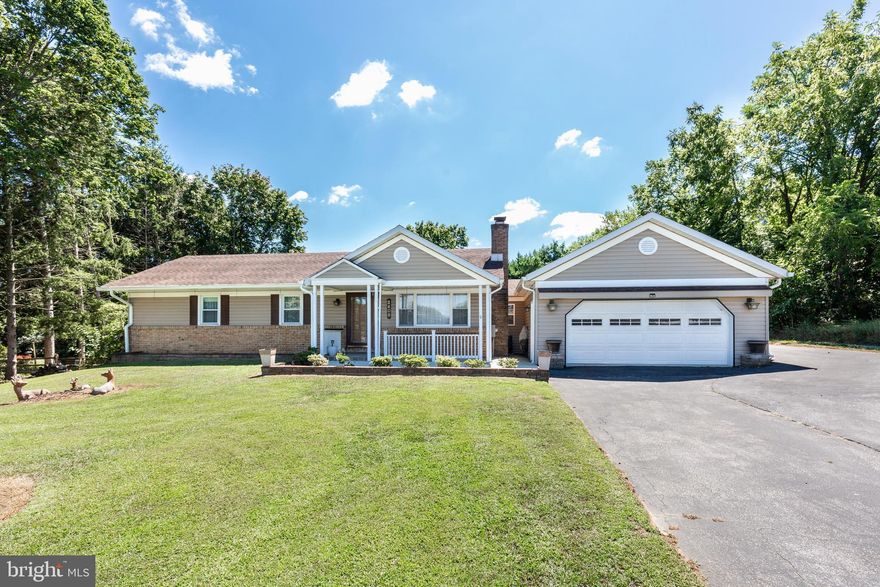A charming covered front porch welcomes you to a fantastic rancher with tons of great updates *  Massive addition w/2 car garage and Family Room * Family room features cathedral wood frame ceilings w/pellet stove and stone surround * Living room area features a 2nd pellet stove * Kitchen and upstairs bathroom have been beautifully updated * New carpet and fresh paint in lower level * Lower level provides kitchenette, full bath, potential 3rd bedroom & a rec. room * And then there's the outdoor space! * Enormous, multi-tiered, partially covered deck running the width of the home with stairs down to a large paver patio overlooking a private professionally landscpaed, fenced-in backyard  *  2 Sheds offers plenty of storage * And tucked away on a quiet street w/easy access to 30 for the AM commute