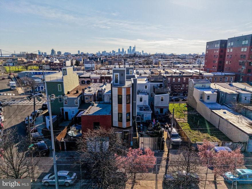 Welcome to 2440 E Harold & 2439 E Huntingdon Street, a brand-new construction homes in the heart of Fishtown with a 10-year tax abatement. 2440 E Harold is 3 bedrooms, 2.5 bathrooms, and nearly 2,000 square feet of finished living space overlooking Aramingo Square. Inside, the home features wide-plank hardwood floors, recessed lighting, high ceilings, and a spacious open living area designed for modern city living. The kitchen is both stylish and functional, offering stainless steel appliances, quartz countertops, a custom tile backsplash, and dual-toned cabinetry. The second floor includes two spacious bedrooms with ample closet space and a well-finished full bathroom. The third floor is dedicated to the primary suite, featuring a spa-like bathroom with double vanity sinks, heated floors, a soaking tub, and contemporary finishes. At the top, a private rooftop deck offers sweeping Philadelphia skyline views, creating the perfect space for entertaining or relaxing. The home also includes a wet bar, adding even more convenience for hosting. The basement provides additional storage space and includes a convenient powder room. Additional features include a dual A/C system, integrated security system with motion sensor, glass-break sensor, and door-open sensors, plus a surveillance system with front and rear cameras. Located just steps from Fishtown restaurants, bars, coffee shops, parks, and neighborhood amenities, 2440 E Harold Street combines the benefits of new construction, smart-home security, and walkable city living in one of Philadelphia’s most sought-after neighborhoods. Schedule your private showing today and experience the best of Fishtown living.
