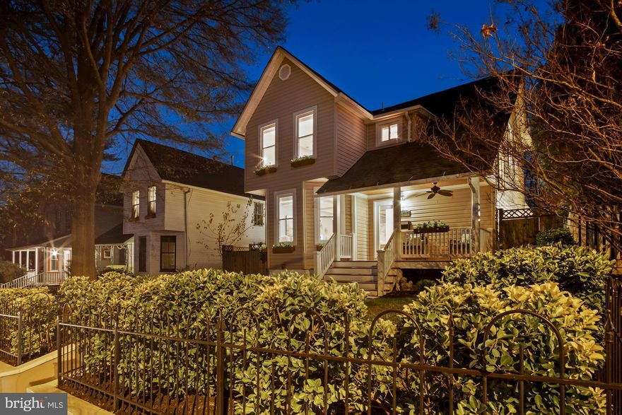 Fall in love with this beautiful Classic Victorian Style home located in the heart of the non-restrictive historic Hyattsville District and steps away from the vibrant Arts District. The picturesque windows and front and grand back porch create a lovely appeal as well as a warm welcome home.  Enjoy your favorite meals in the sophisticated chef's kitchen with top of the line stainless steel appliances, a breakfast bar, and french doors leading to an enormous back cover porch. Relax in this modern open floor plan which is perfect for grand entertaining, allowing for a seamless flow through the living, dining, and kitchen. Among this home, appointments are 9+ coffered ceilings, flushed recess lighting, extensive millwork, detailed wainscoting showcased throughout the home, beautiful hardwood floors on all levels, a warm color palette, built-ins, and an open floor plan are some of the impressive first look features of this home. This home features four bedrooms, three full bathrooms, main level front loaders washer dryer, and a paved driveway for five vehicles.  The lower level is a homeowner's dream which features an in-law suite, modernized to include a full spa-like shower, bedroom, wet bar area, wine cooler, rec area, and separate walkout entrance.  A fully fenced in backyard provides sought after privacy, lush lawn, pergola with seating, and firepit great for entertaining. Walk to famous Sugar Vault Desserts & Bakery, Franklins, Busboys and Poets, Pizzeria Paradiso, Vigilante Coffee, Whole Foods, Yes Organic Market, Pyramid Atlantic, and Art Center Arts Works Now. This home is truly a true retreat to enjoy!