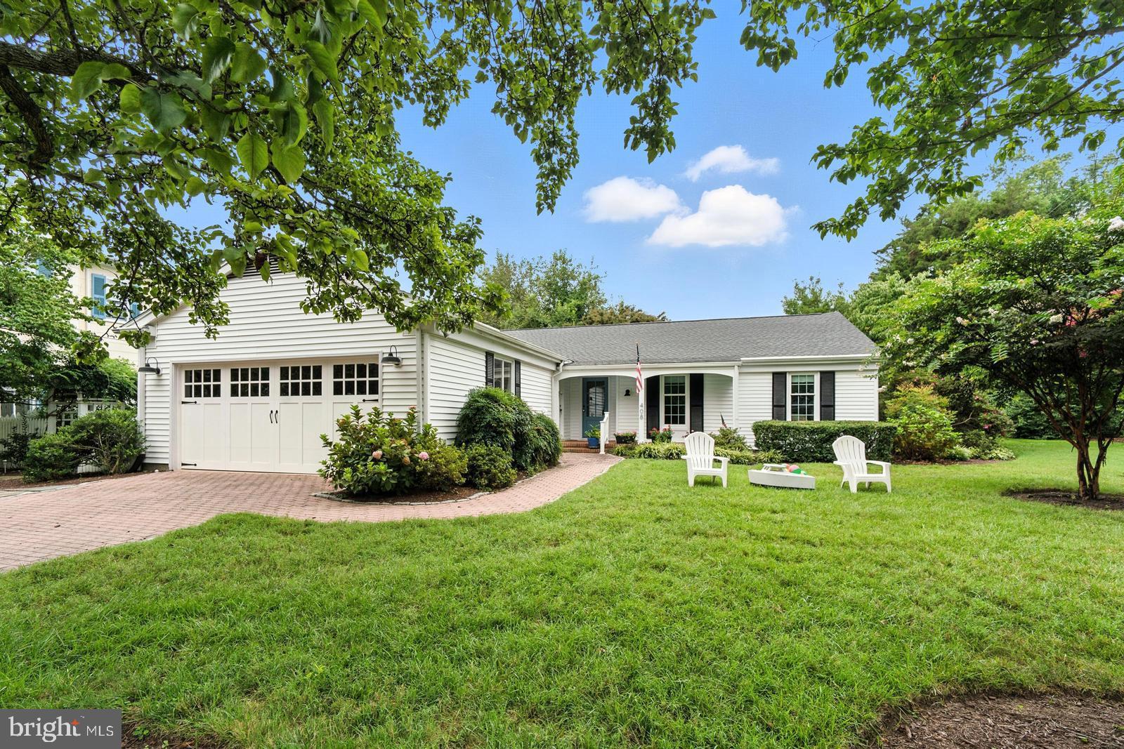 Ideally located in the heart of historic St. Michaels with views of the harbor, this beautifully renovated 3BR/2.5BA coastal-style home offers one-level living, and is the perfect blend of timeless charm and modern comfort. The open floor plan seamlessly connects the living room—anchored by a wood-burning fireplace—to the dining area and gourmet kitchen, creating an inviting space for both entertaining and everyday living.
A three-season enclosed sunroom overlooks the pretty gardens, providing a peaceful setting to relax and unwind. The spacious primary suite serves as a private retreat, thoughtfully designed with a well-appointed ensuite bath and a generous walk-in closet. Two additional guest bedrooms and a full bath ensure comfort and privacy for family and visitors alike.
Just off the attached two-car garage(a rare find in downtown St Michaels) is a large mudroom/laundry room adding everyday convenience and functionality.
Framed by mature trees and vibrant landscaping, this treasured home is tucked away in a quiet corner of town—just steps from boutique shops, great restaurants, art galleries and museums!
*New roof- August 2025
