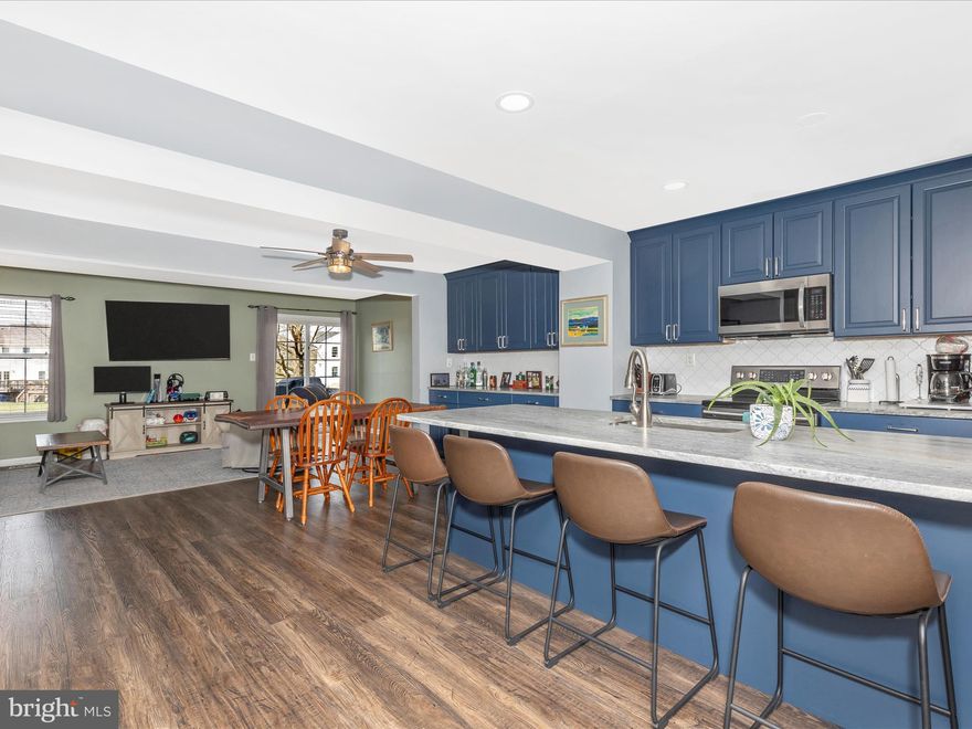 Not your average town home! Expansive gourmet kitchen with huge center island and main level remodel. Updated modern open floor plan with 3 finished levels. Looking for that special place to call home? Well, here it is! This one is hot! Open house Saturday March 22nd from 12- 2. offers 3 finished levels 3.5 baths, walk out basement, fenced backyard with firepit and raised beds, architectural shingle roof, walking distance to community pool, minutes to shopping & commuter routes and more!