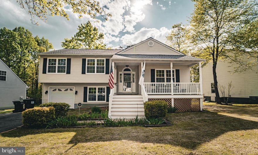 Charming split level home located in the well established neighborhood of Argyle Hills. This 3 bedroom 2 bathroom home is located within 5 miles of downtown Historic Fredericksburg and an easy commute to Quantico. This home totes brand new granite countertops, windows, hardwood floors as well as a newly remodeled bathroom. As you enter the home you're greeted by the foyer and main level of the home which includes a large living room and a charming fireplace with large mantle.  Up one floor you enter the kitchen which comes with stainless steel appliances, a peninsula, and a skylight that allows for a bright and quaint kitchen. It's flows into the dining room which is where you will find even more natural light coming from the glass doors that lead to a large composite deck with a beautiful screened in area and additional deck for grilling. There is a large lighted staircase that leads to the backyard which is full of amazing potential for the new owner. Back upstairs on the rest of the third level of the house is the two bathrooms and 3 bedrooms. The master bedroom contains a walk in closet and bathroom that has a large soaker tub with a skylight and plenty of natural light. The laundry room is located downstairs with rough ins for a third full bathroom. Down the hallway is a 4th room perfect for a office or hobby room as well as the entry for the crawling space and another living area with access to the single car garage.