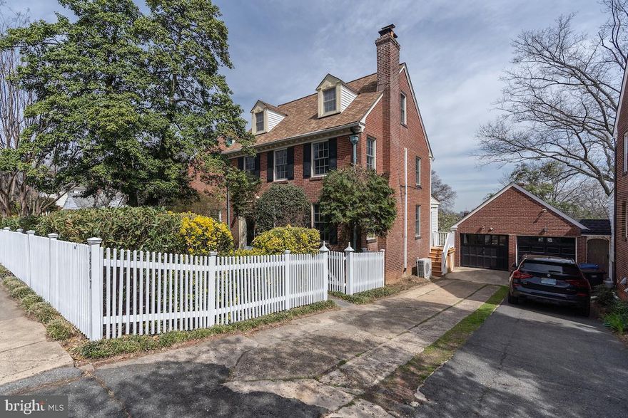 Perched on a ridge in Rosemont overlooking the Potomac River Valley sits this exceptional brick, colonial home enhanced by mature landscaping.  Built with old-school materials and methods in 1937, the structure is solid and enduring.  Thoughtfully remodeled, it now exhibits modern convenience and durability.  New Andersen, double-glazed, double hung windows were installed in 2016.  The upscale architectural shingle roof was installed in 2013 complementing the elegant dentil molding eaves and copper downspouts.  Classic solid wood, six-panel doors and all wood floors remain along with classic millwork including chair rails, elaborate staircase spandrels, and trim molding.  Discreetly integrated modern touches include recessed lighting and track lighting plus towel warmer in the primary bath.  The interior has been freshly painted in versatile, neutral colors.  Features of the remodeled kitchen include stainless steel appliances (Miele dishwasher, Kitchenaid cooktop, oven, and built-in microwave), custom solid maple cabinets, soft-close drawers, ceramic floor tile, and Corian counters with spice storage mini-cabinets incorporated into the backsplash.  The panoramic windows in the adjacent breakfast area offer delightful scenery and the heated ceramic tile floor assures maximum comfort.  A convenient half bath has a space-saving pocket door.  The wall mounted TV in the breakfast area conveys.  A refined mantel with subtle dentil molding graces the gas insert fireplace in the living room.  Numerous closets plus copious built-in shelves and cabinets throughout the home offer extensive display and storage space.  On the top floor, a single large bedroom with its own full bath grants privacy and a romantic ambiance for the masters of the house.

Heating for the home is provided by a very desirable radiator system.  The two-zone furnace replaced in 2019 separately controls the upper and lower sections of the home.  Cooling for the first and second levels is provided by four Fujitsu ductless mini-splits.  A separate heat-pump, forced-air system cools the third level.  The washer and dryer were replaced in 2020.  Massive storage is provided by the cavernous, full basement with 12-foot ceiling.  The garage and driveway afford ample off-street parking.  The basement and loft of the garage offer additional storage.

For transportation access, this location delivers.  Metrorail and passenger rail stations are only a few blocks away and multiple free DASH routes serve this portion of King Street.