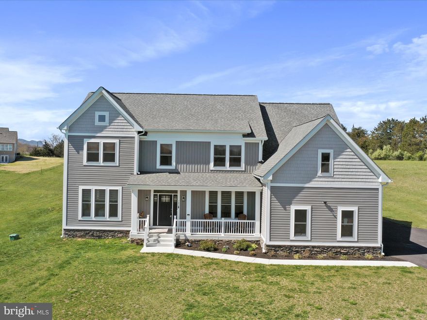 Welcome to your dream home! This stunning residence located in Middletown offers three fully finished levels of luxurious living, designed to accommodate families of all sizes. This home is practically brand new, boasting 5 bedrooms and 5.5 baths, this property is nestled on a sprawling 2-acre lot, offering both privacy and space. Step inside and be greeted by a grand foyer with a beautiful hardwood staircase. A large office/study sits just off the entrance, perfect for those wanting to work from home. The heart of the home is the expansive gourmet kitchen, complete with a center island, high-end appliances including a 30” gas range, combination wall oven and microwave, and a 27 cu. ft. French door refrigerator. Ideal for entertaining, the kitchen flows seamlessly into a formal dining room and a large living room featuring a cozy fireplace.  Just off the kitchen is a cozy eat in sunroom, perfect to sit and drink your morning coffee.  Easily transition to the beautiful backyard, by walking right outside onto your expansive deck and patio area, where the patio area is ready and wired for your hot tub. The backyard is perfect for cookouts and outdoor activities. The finished basement offers even more living space, including a theater room, family room, hobby room, full bath, and bar.  Upstairs, each bedroom has access to a full bath and the laundry center is conveniently located. The primary suite is a true retreat, featuring double sinks with luxurious quartz countertops, an enlarged walk-in shower with beautiful tile, a private gym, and double walk-in closets. Enjoy evenings or early mornings on the full front porch watching the sunset or sunrise. The oversized three-car garage offers ample space for multiple vehicles, tools and equipment.  This home is perfect providing you with both privacy and convenience.  Conveniently located near I-81 and I-66 for an easy Commute.  This lovely home is just minutes from Laurel Ridge Community College, Christendom College, Shenandoah University, grocery stores, theatres, and shopping. You will just love its location, being close to several small towns, making attending festivals and events easy and fun.  The Shenandoah River, hiking trails, wineries and breweries are just minutes away. This home is a rare find, schedule a showing today and prepare to fall in love! No HOA, some covenants and restrictions. Seller is offering Pool table, Foosball, and exercise equipment with full price offer. Check out the Interactive Floorplan and Video