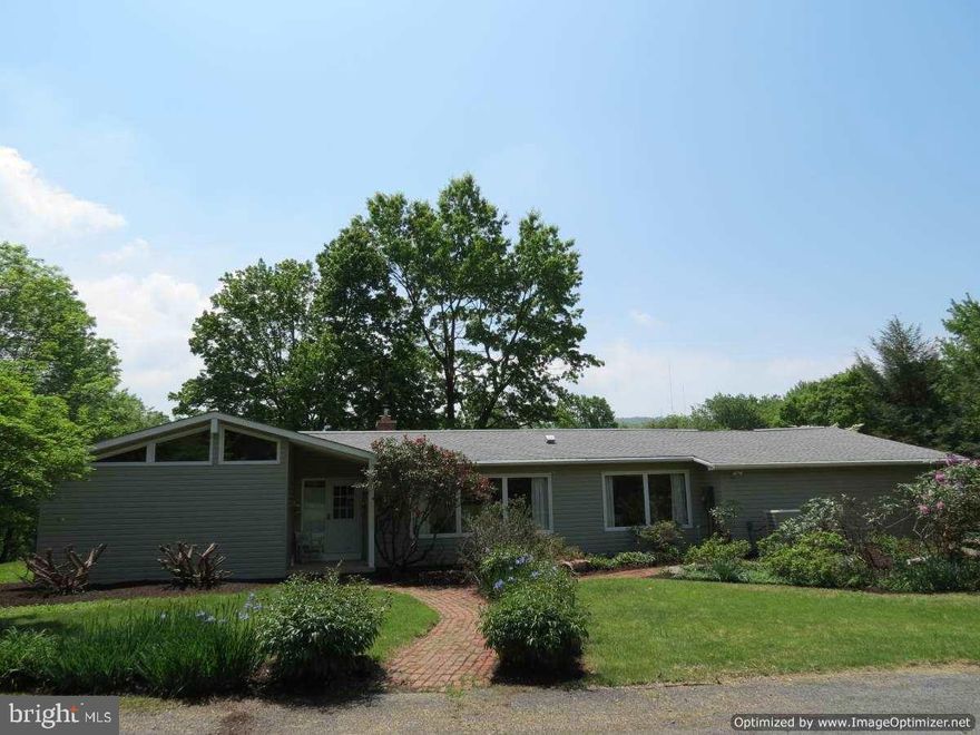 Georgeous setting with privacy & seclusion. This 2,294 SF ranch home is situated on 2 lots comprised of 8.16 acres! 3 bedrm, 3 bath open floor plan includes an office which could be 4th bedrm. Separate bunkhouse has A/C. Tons of natural light, cherry cabinets in KIT, HW in DR & FR w/cathedral ceilings, built in book shelf in FR w/wood fireplace. Large full bsmnt. 2nd lot offers creek frontage to Fishing Creek. So much more to se