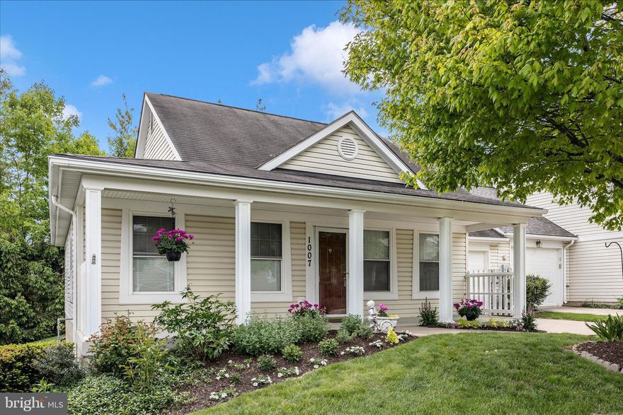 Welcome to this beautifully maintained home in the highly desirable 62+ community of Wildwood Park, offering the ease and comfort of true one-level living. With 2 bedrooms and 2 full baths—and no stairs or basement—this residence is thoughtfully designed for convenience and accessibility.

From the moment you arrive, the professionally landscaped front yard delivers exceptional curb appeal and enhances the charm of the inviting, full-width front porch—perfect for relaxing with morning coffee or enjoying your surroundings.

Inside, the home features fresh neutral paint, new wood flooring, and plush carpet throughout. The well-appointed kitchen is equipped with stainless steel appliances and flows seamlessly into the living and dining areas, creating an open, welcoming space ideal for both everyday living and entertaining.

The spacious primary suite offers a comfortable retreat, complete with a generous walk-in closet and a private en-suite bath featuring a walk-in shower.

Additional highlights include a rear patio just off the kitchen, complete with a retractable awning for shaded outdoor enjoyment, as well as a one-car garage for added convenience.

Ideally located within walking distance to the senior center, library, park, and vibrant downtown, this home also provides easy access to shopping, dining, and everyday essentials, including Safeway and Starbucks.

The HOA covers lawn care, trimming, mulching, and snow removal—providing a truly low-maintenance lifestyle so you can focus on enjoying your home and community.