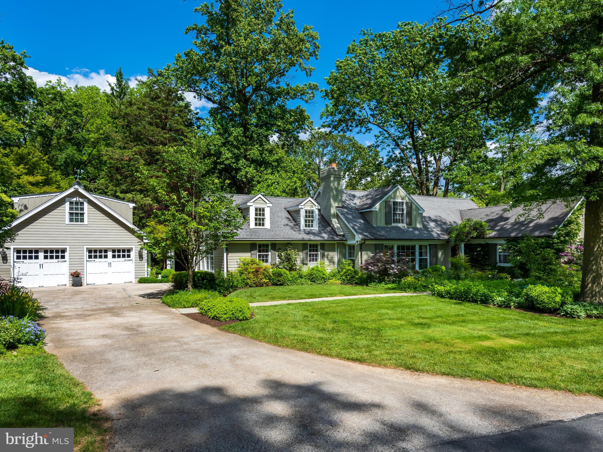 WALK TO WAYNE! This charming Cape has been beautifully maintained and completely renovated by its present owner with a reconfigured floor plan and a private at-home office or nanny suite over the garage! The living space has been expanded to provide a light and bright floor plan perfectly suited to today's modern lifestyles. Centrally located in the heart of the Mid-Main Line in a lovely part of Wayne, this beautifully proportioned home sits on a professionally landscaped lot in a private cul-de-sac enclave. The many custom interior finishes include hardwood floors throughout, built-in cabinetry, many deep windows, crown moldings, built-in speakers, and multiple French doors accessing the extensive outdoor spaces. The charming front entrance leads to traditional sun-filled Living and Dining Rooms which provide a perfect setting for more formal entertaining. The heart of the home is a gorgeous Eat-in Kitchen/Family Room featuring high ceilings with beams, custom lighting, built-in speakers in first floor and patio, custom cherry Wood Mode and Brookhaven cabinetry, and French doors to a lovely blue stone patio. The cook's kitchen also includes a large Sub-Zero wood paneled refrigerator with filtration, two Franke sinks and faucets with Instant Hot, Viking Stove, Warming Drawer, Bosch dishwasher, and Granite Countertops. A spacious island and large open floor plan provide much in demand space for informal entertaining or casual family gatherings. The den with a flat screen TV and French doors to a brick patio is a more private space for use as a second at-home office or for just relaxing after a busy day. The private first floor Master Suite includes a gorgeous limestone with porcelain tile bath with cast iron soaking tub and oversized stone floored glass shower. There is a large walk-in closet/dressing room with every amenity including tie racks, laundry bins, multiple flexible shelves and hanging spaces with a window providing natural light. Also, on the first floor is a multi-purpose room with attached laundry room. The fully renovated second floor includes one bedroom with en-suite bath and two additional bedrooms with a hall bath. All bedrooms have spacious walk-in closets and there are several attic storage spaces. The finished basement provides lots of storage, a work room and a TV/game room with sound deadening ceiling to allow for peace and quiet on the first floor. Outside, the extensive hardscaping with bluestone stone patios are complemented by lovely gardens with specimen plantings extending across the length of the rear of the house, a koi pond, and custom trellis work. In addition to the sophisticated hardscape there is a large fenced grassy play area and an electric fence for pets. An over-sized semi-detached garage with carriage doors was added as part of the extensive renovations, providing finished space above with bedroom, sitting area and full bath, suitable for an at-home office, nanny quarters, or guest suite. With a premier location in the desirable town of Wayne, a 10 minute walk to shops, restaurants and train, award winning public schools, and close proximity major highways, this lovely home will offer unparalleled convenience and great privacy to its new owners.