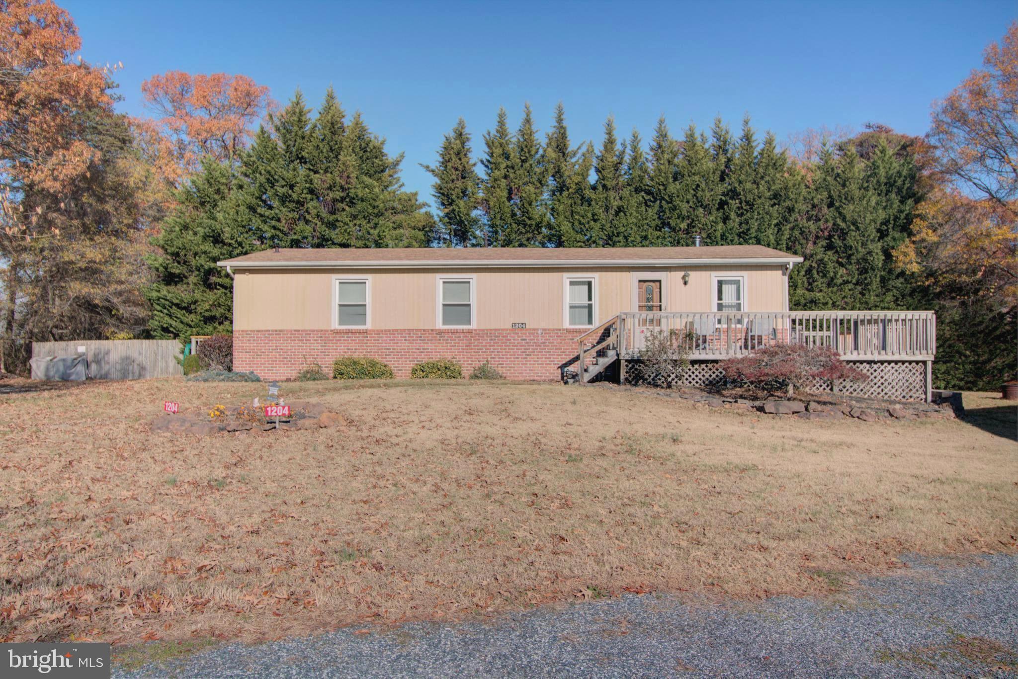 Property is not visible from Clark Station Rd. One acre of land with a x-large 1600 square foot garage building and several large sheds/garages. Kitchen was rehabbed in 2018, Tankless water heater 2022, RV is not staying