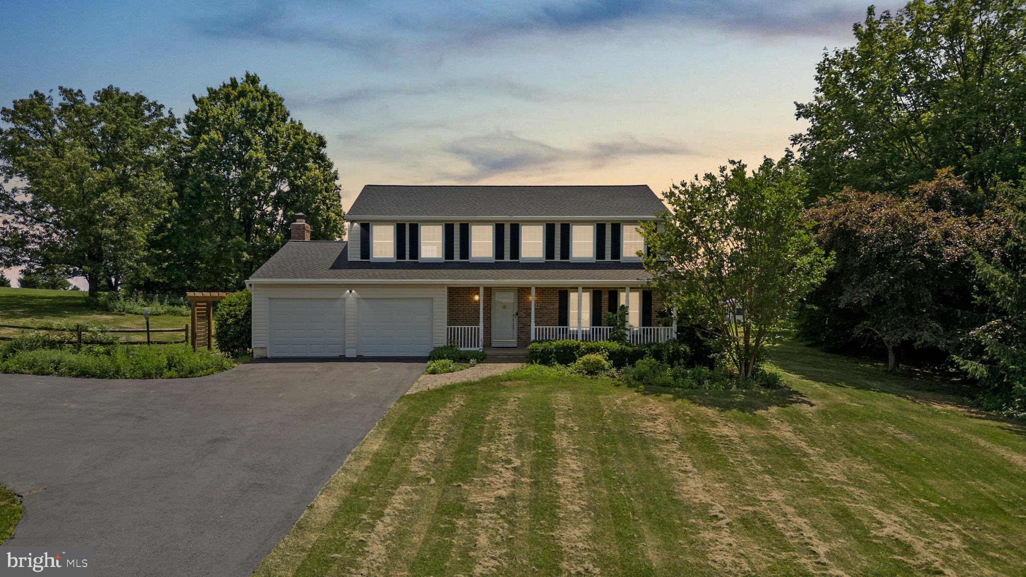 Tucked away on a serene 2-acre parcel in the heart of Sykesville, 1395 Buckhorn Rd. presents a rare opportunity to own a beautifully updated estate-style home in a private, park-like setting. With over 3,200 finished square feet, timeless upgrades, and an exceptional layout, this 4-bedroom, 2.5-bath residence is the perfect blend of refined comfort and peaceful living. A long, private approach leads to a charming covered front porch, where scenic country views provide a tranquil welcome. Inside, the home opens to a bright and expansive main level designed for both everyday living and elegant entertaining. The gourmet kitchen, fully renovated in 2014, is the centerpiece—featuring a massive island, granite countertops, a 5-burner cooktop, double wall ovens, new refrigerator, and a picture-frame window that frames stunning views of the backyard and treetops beyond. The formal living and dining rooms offer space to host with ease, while the family room—anchored by a warm fireplace—invites cozy nights in. Step through glass doors to the oversized screened-in patio, a private retreat for morning coffee, outdoor dining, or evening unwinding. Upstairs, the primary suite is a spacious sanctuary with a walk-in closet and private en-suite bath. Three additional bedrooms are generous in size, complemented by an updated hall bathroom. The lower level walk-out basement features a sprawling recreation area, ideal for a media room, gym, or game space. Luxury vinyl plank flooring was installed throughout the home in 2022, and all ceilings have been professionally redone to remove the original texture for a sleek, modern finish. Roof replaced in 2025 with 30-year architectural shingle, water heater replaced in 2021. This property backs directly to protected parkland, offering unmatched privacy and green space just outside your door. Zoned for top-rated Winfield ES, Mount Airy MS, and South Carroll HS, and with easy access to major commuter routes, this residence provides the best of both worlds—peaceful rural living with modern convenience.
Schedule your private tour today and experience this elegant retreat for yourself.