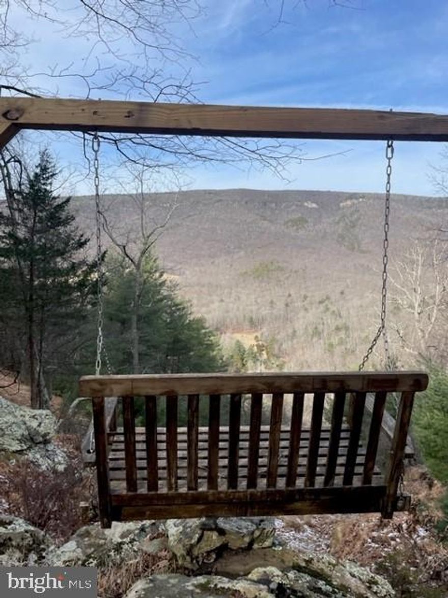If you're looking for plenty of room, spectacular views, excellent hunting or just a great spot to build your perfect getaway, this is the property you've been waiting for!  Small getaway/hunting cabin onsite with separate bath house. Electric nearby.  A second cabin site with World Class View!   Close to National Forest.    Hunt stands already in place.  Make an appt. today!