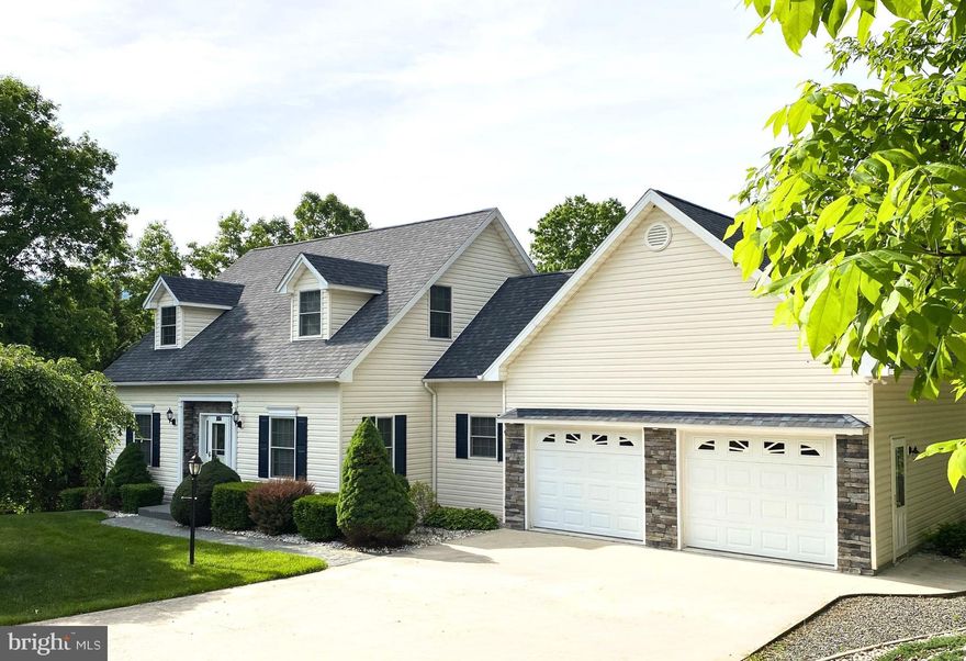 Discover this charming Cape Cod home nestled against a tranquil backdrop of mature trees.  Boasting an open floor plan with nine-foot ceilings and elegant crown molding, this welcoming residence features three spacious bedrooms and two-and-a-half bathrooms.  The first floor offers convenient living with the primary suite, which includes a luxurious owner's bath with a soaking tub, standalone shower, and multiple walk-in closets for ample storage.  The dining room is accented with a classic chair rail, adding a touch of sophistication. The family room features built-in cabinetry, perfect for organization.  Elegant hardwood floors flow throughout the main living areas, complemented by a stunning wood staircase and a cozy stone gas fireplace.  Enjoy spacious, comfortable rooms designed for easy living and entertaining.  Step outside onto the beautiful rear deck and immerse yourself in nature—ideal for outdoor gatherings or a peaceful retreat.  This property also includes an attached two-car garage, providing additional storage and convenience.  Don’t miss the opportunity to make this lovely home yours! Call today to schedule your private tour.