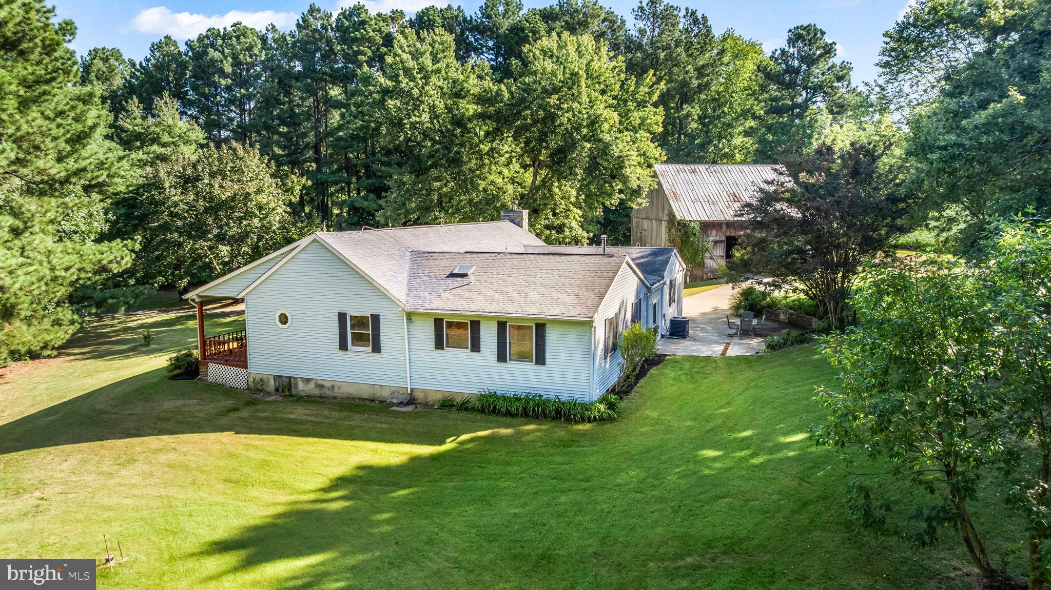 Welcome to 1610 Twirly Court, tucked away in a quiet cul-de-sac and surrounded by generational farms and wide-open fields. This single level home sits on nearly three acres, offering a lifestyle of peace and privacy while still being just minutes from the shops, restaurants, parks, and entertainment of central Calvert County.
Water enthusiasts will want to bring their kayaks as this home includes private community water acces!
Fall in love with the charming old barn with an upper loft, the children’s play area, mature fruit bearing trees blueberry bushes, strawberry plants and grape vines, plus a backdrop of seasonal crop fields. A long, paved driveway leads you to the welcoming covered front porch, which spans the entire width of the home and is deep enough for relaxing or entertaining. This porch features a hand carved heart in every slat—a true labor of love.
Inside you will find a comfortable and open floor plan. The kitchen features an island and flows easily into the dining and living spaces, where a custom stone wood-burning fireplace creates a cozy focal point. A sunroom offers light-filled living space year-round, while the rear patio extends your entertaining options outdoors. The sellers previously used the sun room as a fourth bedroom so lots of potential for all of your living space needs.
The one-car garage connects to a practical mudroom, half bath and laundry area, keeping daily life organized. The primary suite is a true retreat, with multiple closets, a private bathroom, and a large sitting area ideal for a home office, nursery, or quiet lounge. Two additional bedrooms and a full hall bath complete the home.
Freshly painted and ready for its next chapter, come see it today!