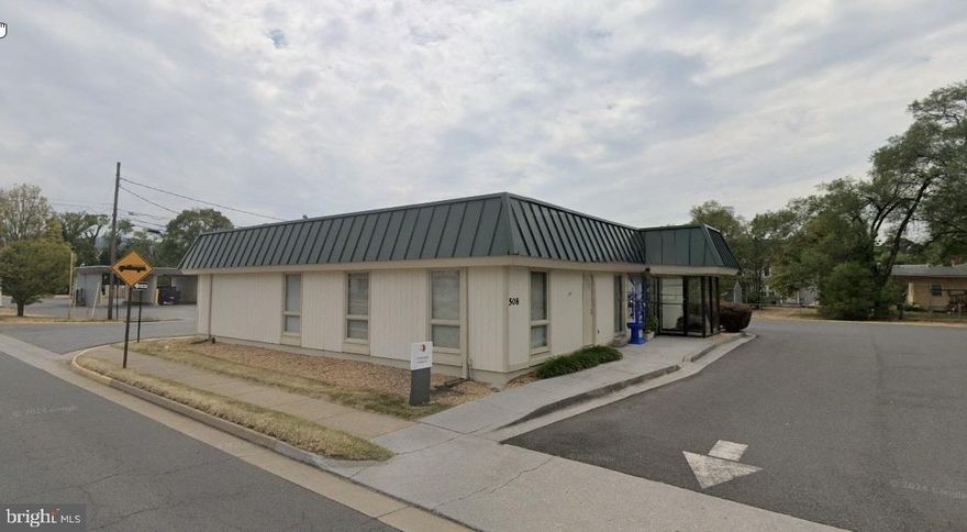 Exceptional commercial property located on the corner of North Commerce Avenue and East 5th Street in downtown Front Royal. This ±3,143 SF single-story building sits on 0.5165 acres and is zoned C1, offering flexibility for office, retail, or mixed-use applications. The site benefits from high visibility and accessibility, with a traffic count of 15,246 vehicles per day, and is just three blocks from the Warren County Government Center and the U.S. Post Office.
The building features seven private offices, a conference room, two restrooms (including one handicap accessible), an entry vestibule, and a small lobby area. A 375 SF drive-through banking suite is currently leased to First Bank through September 2027, with extension options through 2030, providing stable rental income.
Utilities include public water and sewer, electric, and oil heat. Shared monument signage is available. With only 12% of the building currently leased, the property presents a strong opportunity for owner-users or investors seeking additional leasing potential.
Offered at $825,000. Showings by appointment only.