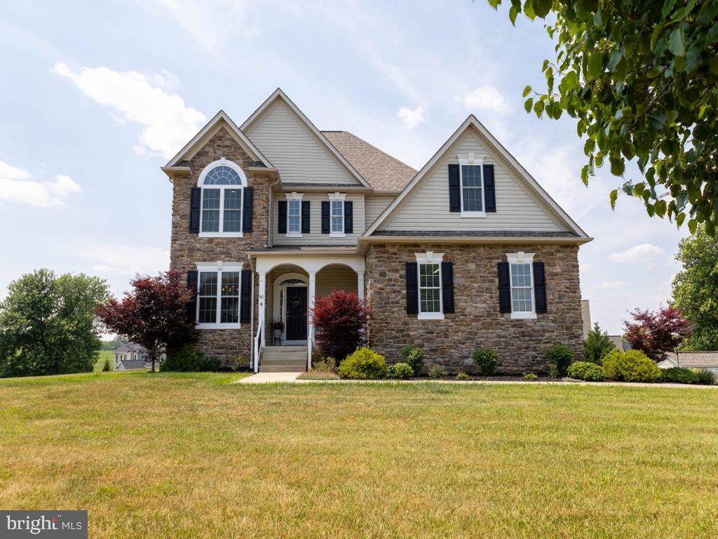 Beautiful 2 story home with a mountain view located in the exclusive Eastland neighborhood. Minutes away from multiple routes to NOVA its great for commuting. Enter into this open and airy floor plan with elevated ceilings and flooded with natural light. Main level living has hardwood floors throughout, propane fireplace, a formal dining room and a separate breakfast area. The kitchen boasts ample cabinet space, granite counter tops, stainless steel appliances and a pantry. The main level master suite has a tray ceiling and separate walk-in closets. The spacious ensuite bathroom contains a double vanity, heated tile floor, garden tub and a walk-in shower. Upper level has 4 bedrooms (or use 1 as a spacious bonus room) and two full baths. Enjoy sunsets from the composite deck or exit out of the large partially finished basement onto a covered patio. The spacious basement is great for a home theater with in-wall/ceiling speakers. There are also 3 adjoining flex rooms, an ample storage room and a full bath. New roof 2018 and 2 smart water heaters installed within the last year. All new carpet throughout house. This serene neighborhood has private nature trails and a scenic pond. House is located on a quiet cul-de-sac. This house is a must see!