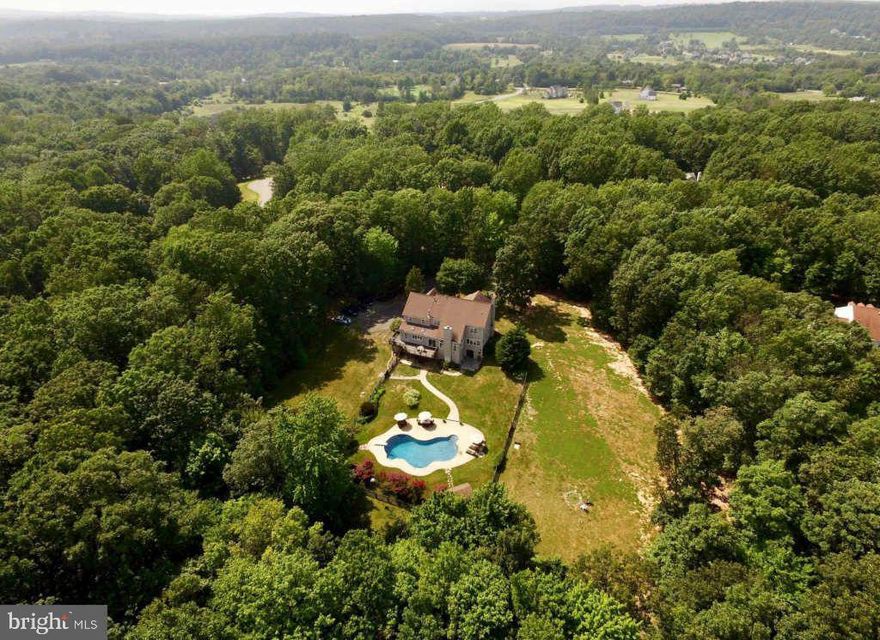 NICE HOME ON OVER 3 ACRES IN SOUGHT AFTER ROLLING RHODES COMMUNITY - CUSTOM PRIVATE POOL SURROUNDED BY WOODS - LARGE 5 BEDROOM 4.5 BATH WITH FULLY FINISHED BASEMENT - 3 CAR GARAGE - HOME IS PRICED WELL BELOW COMPS FOR QUICK SALE PRIOR TO OWNERS STARTING A REMODEL - 4 LARGE BEDROOM AND 3 FULL BATHS ON UPPER LEVEL - NEEDS PAINTING AND SOME COSMETIC WORK -SOLD IN AS-IS CONDITION