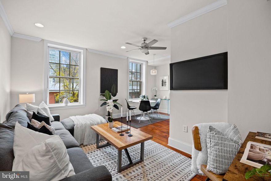 Sun and serenity await in this lovely one-bedroom, one-bathroom condominium featuring renovated interiors, skyline views, generous storage, low monthly fees and an ideal location just two blocks from Rittenhouse Square.

Inside this beautifully arranged home, tall ceilings rise above restored original pine floors, crown molding and oversized six-over-six windows framing open-sky and treetop outlooks. A gracious entry hall flanked by a roomy coat closet ushers you into an open living/dining area with recessed and pendant lighting. Ahead, the updated kitchen features rows of white cabinetry, granite countertops, and full-size stainless steel appliances, including a range, dishwasher and built-in microwave. Sleep soundly in the spacious bedroom, featuring great closet space and plenty of room for a reading nook or office area. A full bathroom with a large tub/shower and large vanity completes the layout, while additional basement storage adds wonderful convenience to this charming Rittenhouse haven.

Built in 1845, 1708 Pine Street sits among a stately, uniform row of 20 late Greek revival brick townhouses with marble trim. From its quintessential tree-lined block within the Rittenhouse-Fitler Historic District, this home offers unparalleled access to Center City amenities. Just blocks away, the Kimmel Cultural Campus features performances by the Philly Pops and the city opera, ballet and chamber orchestras. Visit renowned museums, take in world-class dining and enjoy proximity to elite hospitals and universities. Rittenhouse Square and Schuylkill River Park provide lush outdoor space, and transportation is effortless with easy access to buses, the 15/16th & Locust Street Station and the 30th Street Station.