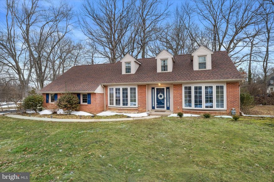 Open House Saturday 12–2 PM. Located in desirable Foulk Woods, this classic North Wilmington Cape sits on a half-acre+ corner lot and offers a blend of space, character, and comfort that truly feels like home. 
At the heart of the home is a timelessly renovated kitchen (2017) featuring Cambria quartz counters, pull-out drawers, and a multifunctional island that provides both prep space and storage. The bright breakfast area includes built-in bench seating with hidden storage. 
The main level continues with a welcoming living room featuring a wood-burning fireplace, built-ins, and a four-panel bow window, a spacious dining room with its own bow window, and a comfortable family room, also with built-ins, offering direct access to the backyard, ideal for everyday living and entertaining. A convenient main-level primary suite includes a tastefully remodeled bath (2024), while the laundry/mudroom just off the turned two-car garage creates an easy everyday entry. 
Upstairs, the three additional bedrooms are notably spacious and full of character, with classic dormer details that bring in natural light and give each room its own personality. A second fully remodeled bath (2024) and a floored walk-in attic provide excellent functionality and storage. 
A full unfinished basement offers plenty of room for storage, hobbies, or future finishing potential. Outside, enjoy a fenced yard and natural landscaping, all combining charm, comfort, and everyday livability in one of North Wilmington’s most sought-after neighborhoods.