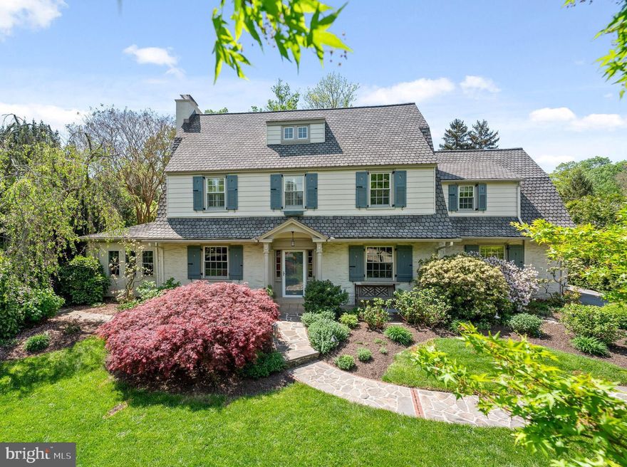 Tucked away in the picture-perfect enclave of Hilaire—one of Radnor’s most
desirable neighborhoods—this lovingly maintained colonial blends historic charm
with modern-day conveniences. A Belgian-block lined driveway and stone path
lead to the inviting front porch, setting the tone for the warmth and craftmanship to
follow. Inside, architectural details abound, from intricate moldings and refined
millwork to deep-silled windows that bathe the home in natural light. Off the foyer,
a formal living room welcomes all with its wood-burning fireplace, custom
built-ins and adjacent sunroom with lofted ceiling. French doors connect to a
sprawling kitchen and family room where gleaming hardwood floors, neutral
finishes and a vaulted, beamed ceiling create the perfect setting for gatherings and
everyday living. Thoughtfully designed with a center island, appliance garage and
ample cabinetry, the kitchen flows effortlessly into a breakfast area and windowed
family room just beyond, where French doors open to the rear terrace—ideal for
dining al fresco. Other main floor highlights include a powder room, spacious
laundry-storage room and secondary staircase, plus a formal front dining room
with built-in cabinetry that offers the perfect space for special occasions. Upstairs,
the primary suite features an ensuite bath with frameless glass shower door, tasteful
tilework and built-in shelving. Three secondary bedrooms, separate office and a full hallway bath
complete the second floor. The third level houses two additional bedrooms—ideal
for guests, a home office or creative space—and a full hallway bath. The private
backyard features an elegant stone terrace that steps down to a grassy expanse, a
storage/potting shed, direct access to the one-car garage. A private path leading
straight to the St. Davids train station can be easily accessed for a short walk to the train.  This storybook neighborhood is a short stroll from downtown Wayne, award-winning Radnor schools, parks, playgrounds,
Radnor Memorial Library and more! Don’t miss this rare opportunity to own a
classic home in one of Radnor’s best neighborhoods!