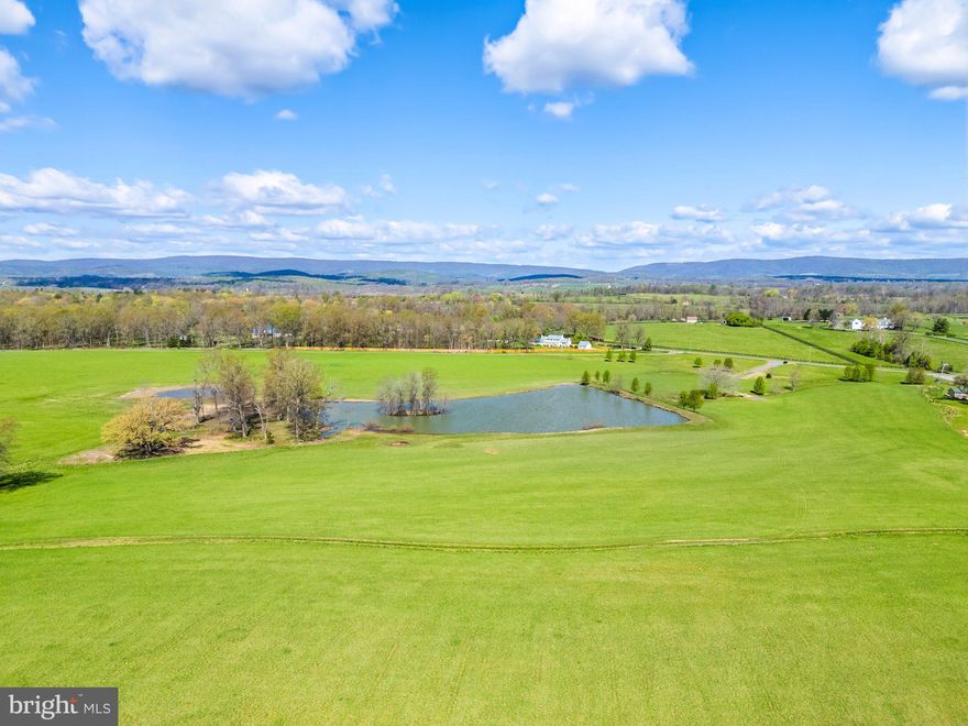 Juno Farm - 163 acres of premier land in Orange County Hunt Territory.  Breathtaking property located on the protected Atoka Road.  Approximately 100 acres of hayfields and over 60 acres of mature woodland featuring majestic stands of white oaks, hickory and walnut trees.  Wonderful riding trails and wildlife habitat.  Protected by a Land Trust of Virginia conservation easement, its natural beauty is protected for generations to come while still allowing for construction of a residential compound and comprehensive equestrian facilities including the ability to build an indoor arena.  Lovely combination of open and wooded land, mountain views, large fishing pond and one smaller pond for waterfowl.  Extensive year round springs running through out. 
PROPERTY IS NOT DIVIDABLE