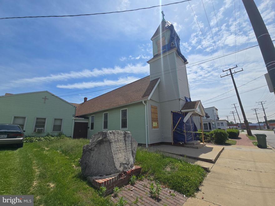 Property sold in as-is condition.  Property damage exists at the front from a car crash, and as a result, the property has been condemned by Baltimore City. No entry is allowed for touring except as a contingency upon ratification of a contract to purchase. Sales price includes four abutting lots at 2106 Maisel St., 2120 Maisel St., 2124 Maisel St., 2126 Maisel St. Value is in the land, and the church building is in need of repair and renovation. No entry is allowed except as described above. Price based on condition. Cash sale only. Zoned industrial, minutes from I-295 and downtown waterfront.