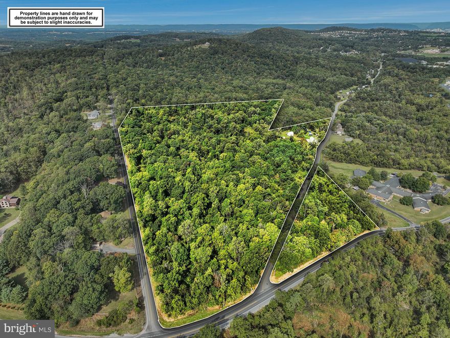 48+ Acre Property with Endless Potential!  Conveniently located with easy access to I-83, this 48+ acre property is perfectly situated between Harrisburg and York. Offering beautiful views from multiple vantage points, the land provides a unique blend of privacy and accessibility from Pleasant View Rd or Ridge Rd.  A little over 3 acres are zoned for single-family residential (click on Bright documents icon to view zoning docs), with the remaining acreage zoned rural residential, making this an excellent opportunity for subdivision or future development. Public water is across the street and public sewer is on an adjacent property, adding to the property's potential.  The land is mostly wooded, except for open space around the home, and is enrolled in Clean & Green, keeping taxes low.   The existing home (MLS   PAYK2090214) was most recently used a two unit rental ( 1 BR 2 BR units) but can easily be converted back a single family dwelling.  There are two 2-car garages and a barn on the property. Seller will consider all offers!  See Bright documents for addtional information.