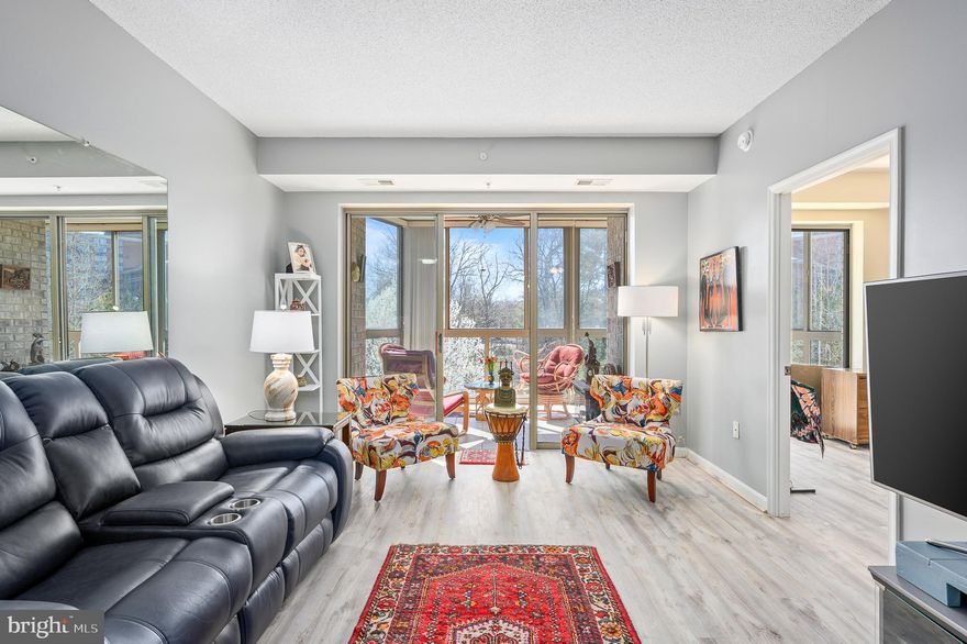 Welcome to 19355 Cypress Ridge Terrace Unit 422, a stunning condominium nestled in the Riverview building in Lansdowne Woods, Leesburg’s premier 55+ active adult community. This beautifully upgraded 2-bedroom, 2-bathroom home offers the perfect mix of modern touches, comfort, and low-maintenance living.

Step inside and be welcomed by a beautiful custom tiled floor in the entryway and new luxury vinyl plank (LVP) flooring that flows seamlessly throughout the entire home, adding a fresh and contemporary feel. The open floor plan is bathed in natural light, with the living and dining areas providing an airy and inviting space to relax or entertain. The enclosed balcony is enhanced with solar applications on the windows and added vents to help with air circulation, making this the perfect spot to enjoy your morning coffee or unwind with a book while basking in peaceful, tree-lined views.

The kitchen boasts refaced cabinets that elevate the overall aesthetic, gorgeous granite countertops, and ample space to whip up your favorite meals or host friends for an intimate dinner gathering. Dishwasher, stove, microwave replace in 2021. Countertops & sink replaced 2021.

The primary suite serves as your private retreat, featuring a spacious layout, a walk-in closet, and a serene en-suite bathroom. The second bedroom, with private bath, offers versatility—ideal for guests, a home office, or a creative hobby space.

Life at Lansdowne Woods is about so much more than just the home—it’s a lifestyle. Indulge in resort-style amenities, including a state-of-the-art fitness center, an indoor pool, tennis courts, a clubhouse with an active social calendar, and peaceful walking trails. Plus, you’re just minutes from shopping, dining, and the rich historic charm of downtown Leesburg.

This is your chance to own a thoughtfully updated home in an incredible community. Schedule your private showing today and experience the perfect blend of luxury and carefree living!