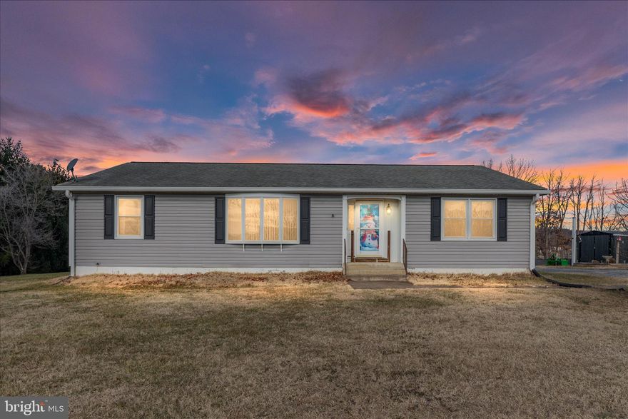 Well-maintained rancher on 3 unrestricted acres offering 1,820 sq ft of comfortable main-level living with an unfinished basement. This 3-bedroom, 2-full-bath home features numerous updates, including a 2-year-old HVAC system, new siding (2018), and roof and windows replaced in 2008. Enjoy outdoor living on the side porch and rear Trex deck added in 2021.

Major improvements include $10,000 in foundation work completed in the basement in 2025, accompanied by a transferable warranty. Additionally, the septic system was pumped and inspected on September 6, 2025, and an active maintenance agreement is in place with Enboden Environmental Service. Additional upgrades include a newer water heater and a concrete cellar door installed in 2017.

The property offers beautiful mountain views from the front, a private backyard backing to trees, fruit trees, raised garden beds that will convey, and ample space for gardening or animals. Multiple outbuildings provide excellent storage, with one equipped with electricity. A rare opportunity for unrestricted acreage with extensive updates and peaceful surroundings.