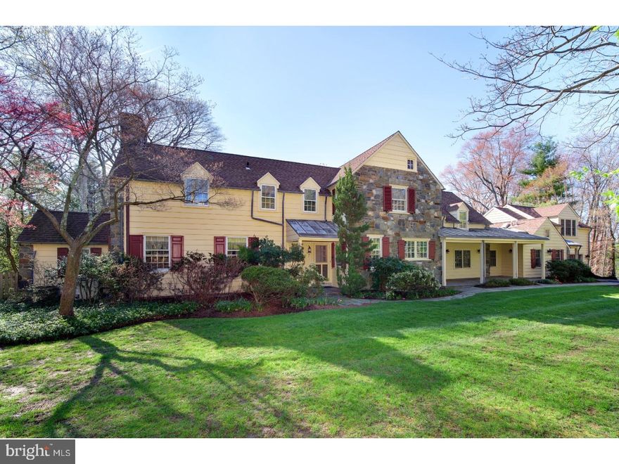 The "New Traditional" Bright, exciting,farmhouse colonial sparkles with recent updates, superior finishes and lightfilled floorplan in desirable Wynnewood.  Charm and style combine to offer an effortless lifestyle in this expanded  5000+ square foot, 4 bedroom 3 full and 2 1/2 bath home on a .78 acre parcel highlighted by walled stone terraces and pergolas wrapped in mature wisteria vines.  Added to over time to reflect the modern day desires and demands, the home offers exceptional gathering and work space throughout its three finished levels. A wide double Foyer offers a glimpse into the Formal Dining Room with gleaming hardwood floors and angled brick surround fireplace. Two steps down lead to a spectacular optic white Kitchen, with honed Carrera marble counters, wide seated island, and hand formed white tile back splash brightened by front to back of house exposure. Without interruption, the Kitchen flows through the Breakfast Area and into a large Family Room with sweeping solarium sized window. A built-in desk and custom shelving offer a centralized work space providing "plug-in" tech access and generous flat work space. Outfitted with multiple closets, cubbies, benches and radiantly heated floor below, the volume ceiling Mudroom and walk in pantry offers important connected space from the two car Garage and provides a hangout space for the Loft/Bunk Room overhead. Formal Living Room with handsome wood burning fireplace is positioned off the Center Hall and enjoys light from and access to the step down Sun Room with wrap around windows and exit to the rear yard and terraces. An arched opening from the formal space  leads to a most intimate Office, perfectly positioned for privacy and warmed by a corner set wood burning fireplace. The full wall of shelves is both a stylized background as well as meaningful storage. Ascend to a charming, dormered ceiling Master Bedroom. Three fully outfitted closets offer ample storage and the neutrally appointed Bath is highlighted by a large seated shower and seamless glass enclosure. Three additional Guest/Family Bedrooms and two nicely updated Baths allow for maximum flexibility in second level floorplan. On the lowest level find a large Recreation Room with high ceilings and centrally focused stone surround fireplace. Laundry, mechanicals, storage and Bilco door exit to the yard for ease of storing lawn furniture.