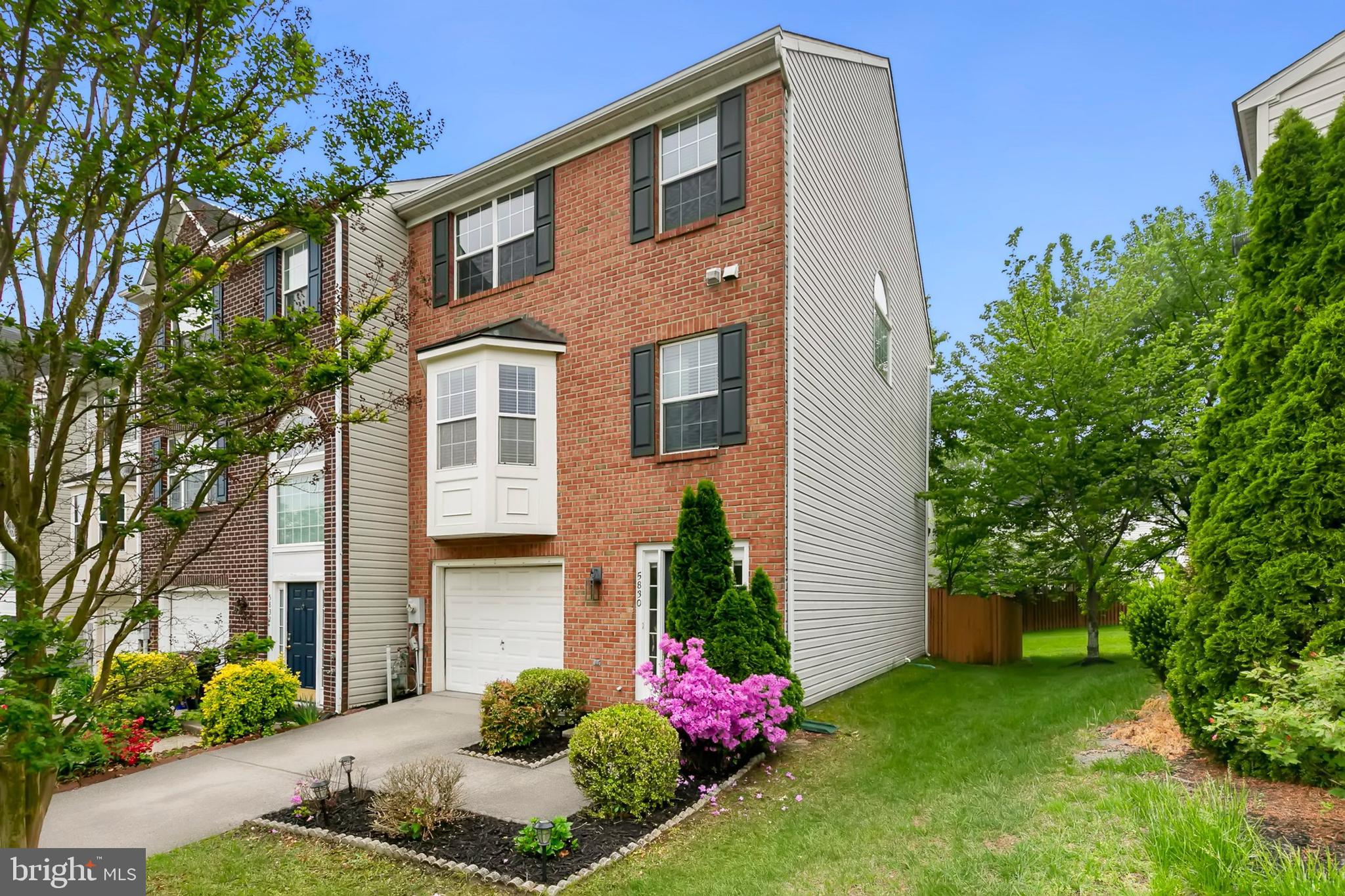 Welcome to this stunning 3-level, brick-front end-unit townhome offering 2,112 square feet of refined living space. With 3 bedrooms, 2 full bathrooms, and 2 half bathrooms, this home perfectly blends luxury and convenience in the highly desirable Lyndwood community. This home has been thoughtfully upgraded, including a 2015 natural gas HVAC system, a 2011 roof replacement, and a newly updated water heater. The gourmet kitchen is a chef's dream, featuring sleek stainless steel appliances, beautiful granite countertops, a tile backsplash, 42" cabinets, and ceramic tile floors. The sunny bay window with built-in bench seating provides extra storage, and the open-concept layout flows seamlessly into the dining and living rooms, creating an ideal space for entertaining. Gleaming hardwood floors extend throughout the living and dining areas, with a cozy gas fireplace as the focal point in the spacious living room. The main level also includes a convenient laundry room and powder room for added ease. The primary suite is a luxurious retreat, boasting elegant vaulted ceilings, a large walk-in closet, and a spa-like ensuite bathroom with double sinks, a relaxing soaking tub, and a separate shower. Two additional bedrooms provide ample space for family or guests, and they share a full bathroom. The fully finished, walk-out lower level features an inviting foyer and a spacious family room, along with a convenient half-bath. Step outside to the private patio and beautifully landscaped backyard, perfect for outdoor relaxation. Freshly repainted in neutral tones with upgraded light fixtures throughout, this home is ideally located just minutes from restaurants, shopping, gyms, banking, and the Timbers of Troy Golf Course. Commuting is a breeze with major roadways and BWI Airport easily accessible. With the perfect combination of comfort, style, and convenience, this home offers everything you need. Schedule your tour today!