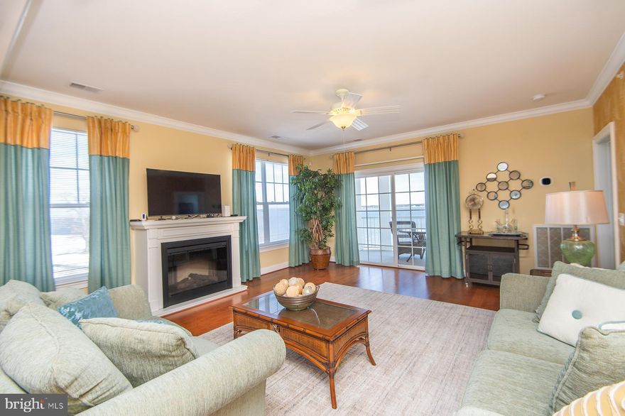 Located at the Residences of River Marsh and adjacent to the Hyatt Regency Chesapeake Bay Resort, this 2-bedroom, 2-bathroom condo offers luxury and stunning views. This 4th floor end unit overlooks the signature 18th fairway and the Choptank River, providing some of the best scenery in the community. Originally a model unit, it features upgraded finishes throughout and is being sold fully furnished. 
The primary bedroom suite includes a spacious walk-in closet, a secondary closet, and an adjoining bathroom with a ceramic tile walk-in shower, separate soaking tub, and dual sink vanity. The split floorplan ensures privacy for the second bedroom, which is located near a full bath. Additional features include a large laundry room equipped with a stack washer/dryer and two beverage refrigerators.
Enjoy easy access to the full-service marina, perfect for exploring the Choptank River and Chesapeake Bay. Nearby amenities include dining, fishing, and crabbing, as well as the River Marsh golf course, which features a driving range and a stunning finish right in front of your balcony.
Situated on Maryland’s Eastern Shore, this property is an ideal vacation retreat or primary residence, conveniently located within a 2-hour drive to Washington, DC, and just 1.5 hours from Baltimore.