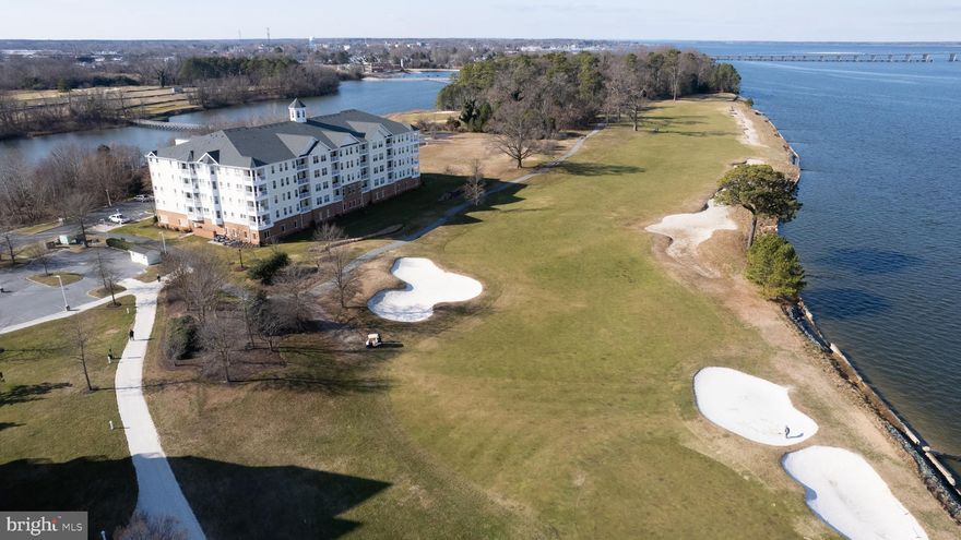 Located at the Residences of River Marsh and adjacent to the Hyatt Regency Chesapeake Bay Resort, this 2-bedroom, 2-bathroom condo offers luxury and stunning views. This 4th floor end unit overlooks the signature 18th fairway and the Choptank River, providing some of the best scenery in the community. Originally a model unit, it features upgraded finishes throughout and is being sold fully furnished. 
The primary bedroom suite includes a spacious walk-in closet, a secondary closet, and an adjoining bathroom with a ceramic tile walk-in shower, separate soaking tub, and dual sink vanity. The split floorplan ensures privacy for the second bedroom, which is located near a full bath. Additional features include a large laundry room equipped with a stack washer/dryer and two beverage refrigerators.
Enjoy easy access to the full-service marina, perfect for exploring the Choptank River and Chesapeake Bay. Nearby amenities include dining, fishing, and crabbing, as well as the River Marsh golf course, which features a driving range and a stunning finish right in front of your balcony.
Situated on Maryland’s Eastern Shore, this property is an ideal vacation retreat or primary residence, conveniently located within a 2-hour drive to Washington, DC, and just 1.5 hours from Baltimore.