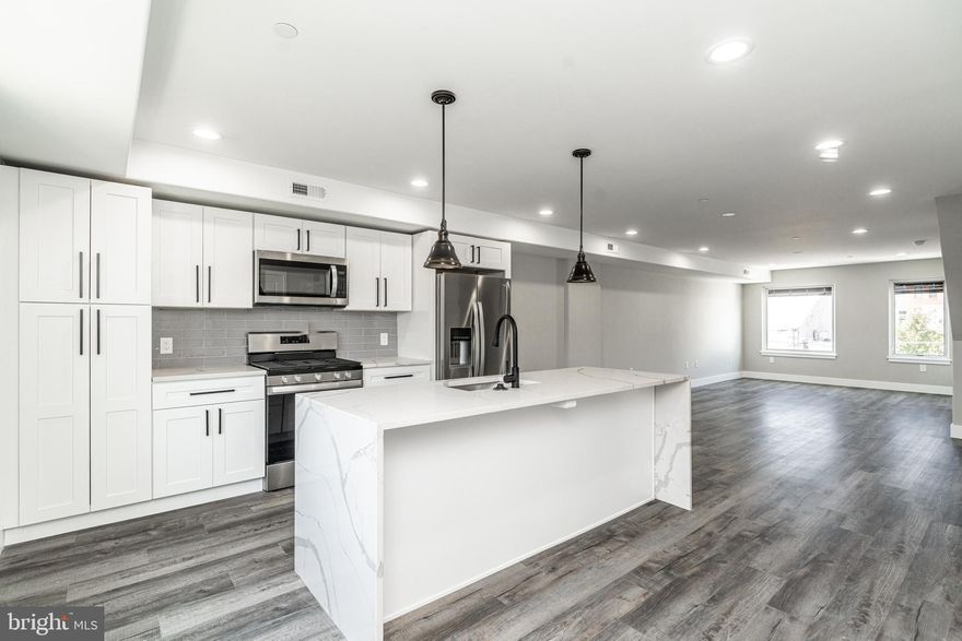 Must-See New Construction! Enjoy breathtaking views of Fishtown from your own private balcony!  Unit 5 is a spacious 1300+ sqft 2 bedroom 2.5 bath bi-level PENTHOUSE apartment. This spacious unit with high ceilings offer tons of natural light and ample closet storage all throughout. The unit welcomes you into the spacious combined living space and modern-design gourmet kitchen, which includes marble countertops, white cabinets, all stainless-steel appliances, and plenty of pantry storage. The space is large enough to spread out with your family, or to host plenty of guests for get-togethers. Connected to the gourmet kitchen is your first half-bathroom with a wall-mounted sink. On the second floor of your penthouse unit, you will find your two large bedrooms with plenty of closet space, both connected to an ensuite bathroom with double-vanity sinks and bathtub. Your washer and dryer units can be found in their own designated closet in the upstairs hallway. The front bedroom connects to your private balcony, and you can also enjoy the massive 1500+ sqft shared roof deck to take in beautiful city views. Don't miss out on this one-of-a-kind opportunity for a gorgeous new construction apartment in a premier location!

This stunning newly-constructed apartment home is right in the heart of Philly's hippest neighborhood of Fishtown. Only a block away from both Frankford and Girard Ave, this unbeatable location puts you within walking distance of public transport, vibrant nightlife locations, bars, restaurants, and galleries.