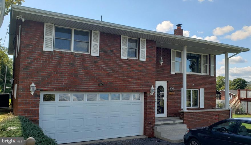 New Price!  Wow!  This home is ready for you!  With just one owner and a quiet neighborhood this three bedroom home has room to entertain inside and out.  The freshly stained 10 X 14 deck  is just through the dining room double doors and there is a sun room underneath for three seasons of comfort. The large 25 X 18 family room has a wood stove for those cooler evenings to hang out as well.   With a level yard that adds just enough green space to satisfy is a double garage with ample space for projects and cars.  Put this on your list before it disappears.