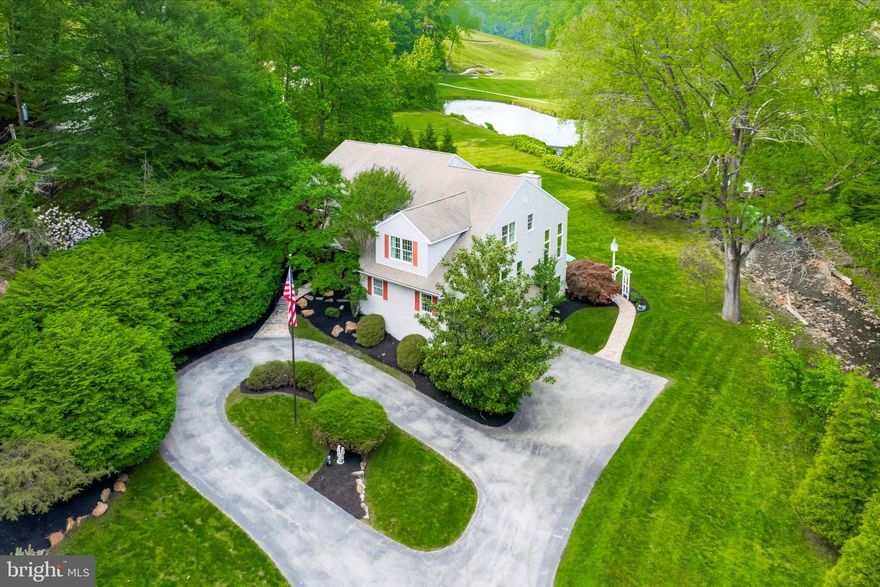 If you’ve been searching for the perfect combination of location, breathtaking views, and a truly exceptional lot—your search ends at 896 Palmers Mill Rd. Nestled on approximately two acres along scenic Trout Run Creek, this meticulously maintained home offers a rare opportunity to enjoy a peaceful, private setting that backs directly onto the 10th hole of Paxon Hollow Golf Course, complete with tranquil pond and waterfall views. This impressive property features a total of six bedrooms and four and a half baths, including a separate in-law suite with its own private entrance. This separate living space includes a bedroom, full bath, eat-in kitchen, and comfortable family room. — perfect for multigenerational living, guests, or au pair accommodations. The main residence includes five spacious bedrooms, three and a half baths, and an attached three-car garage.
From the moment you step onto the charming covered front porch and into the two-story foyer, you’ll appreciate the care and attention to detail that went into the design of this home. To the right of the foyer is a bright and private home office, ideal for today’s remote work needs. To the left, a formal living room flows seamlessly into a gracious dining room with sliding glass doors that lead to a Trex deck—perfect for entertaining or simply taking in the remarkable view.
The heart of the home is the beautifully appointed eat-in kitchen, featuring stainless steel appliances, a center island, granite countertops, a walk-in pantry, and a separate wet bar area. Ceramic tile flooring runs throughout the kitchen, which opens into the light-filled family room. Surrounded by windows on two sides, this space offers stunning views and includes a cozy gas stone fireplace and back staircase to the upper level. A spacious first-floor laundry, mud room and powder room complete the main level, along with the hardwood floors throughout. Upstairs, the luxurious primary suite is a true retreat with vaulted ceilings, hardwood floors, and a private sitting area with a gas fireplace and stunning views. The suite also includes a walk-in closet, two additional double closets, and an ensuite bathroom with a double vanity, soaking tub, and separate shower. Three additional bedrooms, all with nice sized closets, share a well-appointed hall bathroom with a double vanity. This floor is complete with a cedar closet in the hall for added storage. The fully finished, daylight walk-out basement is an entertainer’s dream. With a gas stone fireplace, bar, an included pool and poker table and pinball, a separate ground level bedroom/office and full bathroom. Outdoors, the backyard is a private oasis with lush landscaping, mature trees, and ample space on the deck or patio for relaxing or entertaining. Additional highlights include a whole-house generator and three-zoned HVAC system. Enjoy quick access to all major highways, downtown Media, Newtown Square, Episcopal Academy, Agnis Irwin, Academy of Notre Dame,  Ellis Preserve, and walking distance to the Paxon Hollow Golf Club clubhouse. This remarkable home offers the best of both convenience and serenity. Don’t miss the opportunity to experience the lifestyle this exceptional property provides—schedule your private showing today.