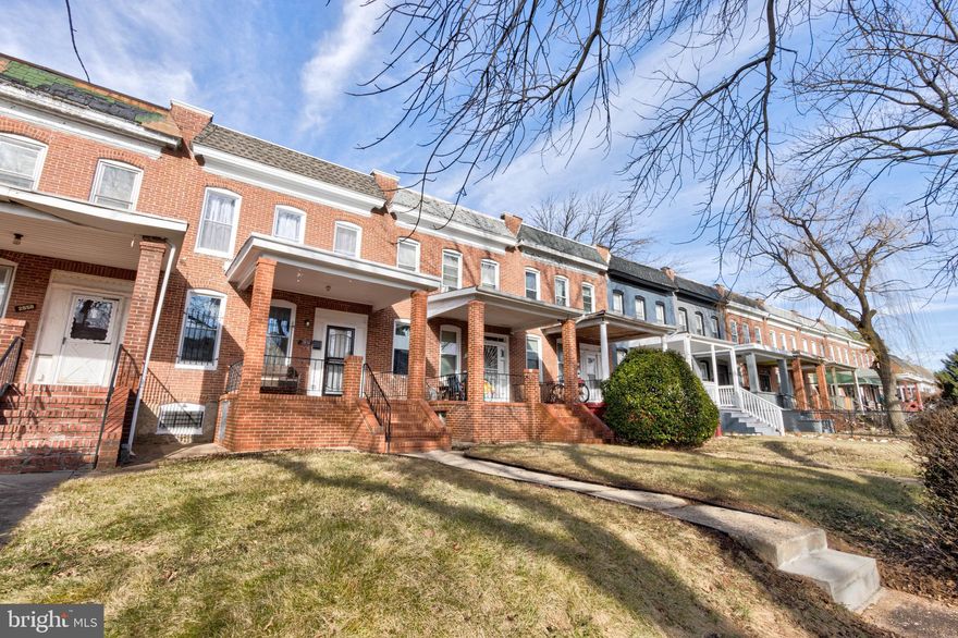 This is the one that you have been waiting for.  Freshly painted throughout, all new flooring, new HVAC, double pane windows, skylight over 2nd floor bath tub and more.  Formal living and formal dining room.  Gorgeous newly renovated kitchen with quartz tops.  There are more cabinets then you'd expect in a Baltimore row home.  Stainless appliances, gas cooking and easy access to fenced rear yard. Easy access to two off street parking spots on rear concrete pad.  Second floor offers three bedrooms with terrific sun exposure and one renovated bathroom with glass tile accents and skylight above tub.  Lower level is  with NEW half partially finished with new half bathroom, gas dryer/washing machine brand new HVAC and Bilco doors that lead to rear yard.  Covered porch makes this one super special.