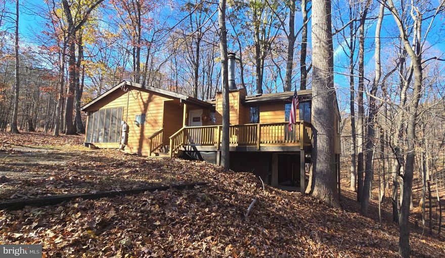 Huge Price Drop!! Motivated Seller!!

Welcome to 759 Tuckahoe Trail, a peaceful 3 bedroom , 2 bath home nestled  in hills of West Virginia, in the beautiful community of "The Woods Resort."  Enjoy a cup of hot coffee in the morning while watching the deer play  or sit  on the screened in back porch after a  hard day, either way,  there just isn't a better setting to find your inner peace.

This home is great for anyone wanting full time living or for a weekend away from it all. This home sits on .78 Acres, on a wooded lot, and  offers a perfect retreat for anyone seeking tranquility without sacrificing convenience  that  so many of us crave. The shed out back, with power, and plenty of work space ,will give you the extra storage you may be looking for and it can be used for a She/He shed.  

The cabin offers a spacious ,open concept living room that flows seamlessly into the dining area, perfect for gatherings and family time. Bring your own vision and  make the updates you want or need, with a little love this  could be a true beauty .
 
Don't miss this opportunity to make this charming home yours,. 

Schedule your showing ASAP, this one will not last ...