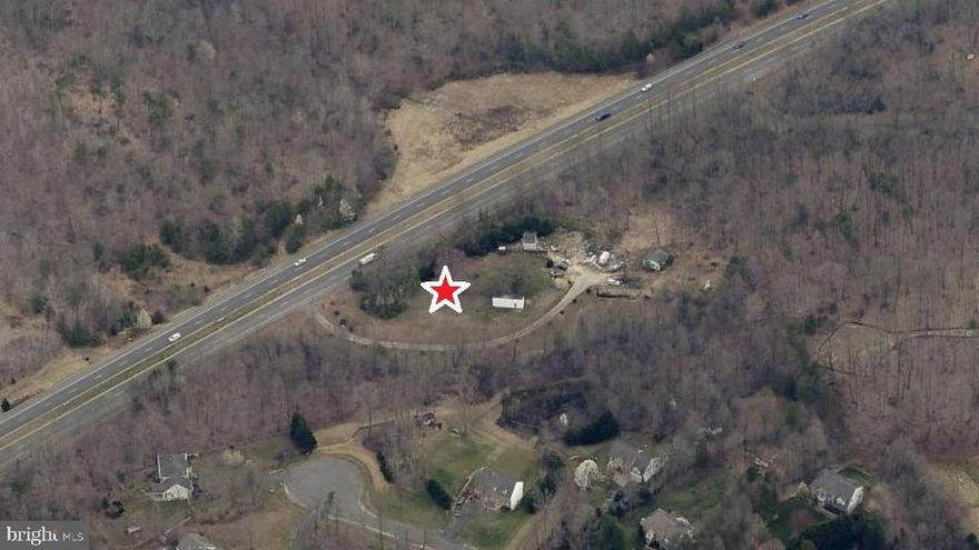 4.76 ACRES FRONTING HOADLY ROAD.  (Also known as 6616 Token Valley - Lot A).    Long Road frontage with treed border for privacy.  Approved 5 Bedroom Perc.